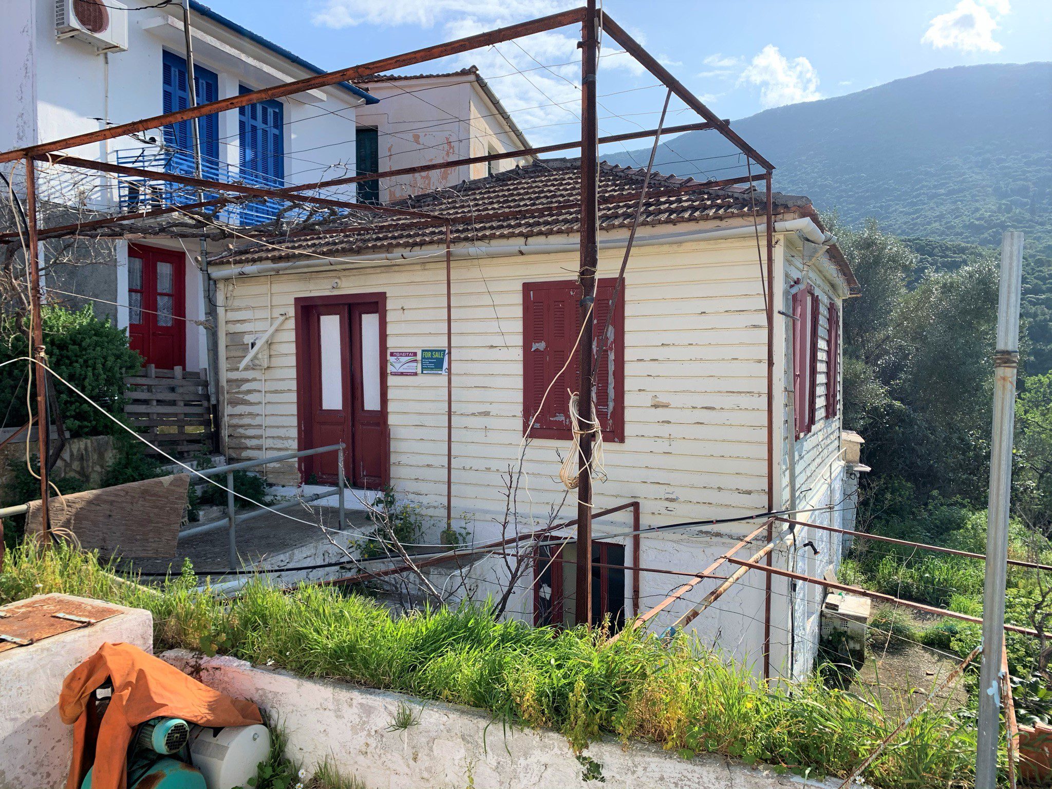 Exterior facade of house for sale in Ithaca Greece, kioni