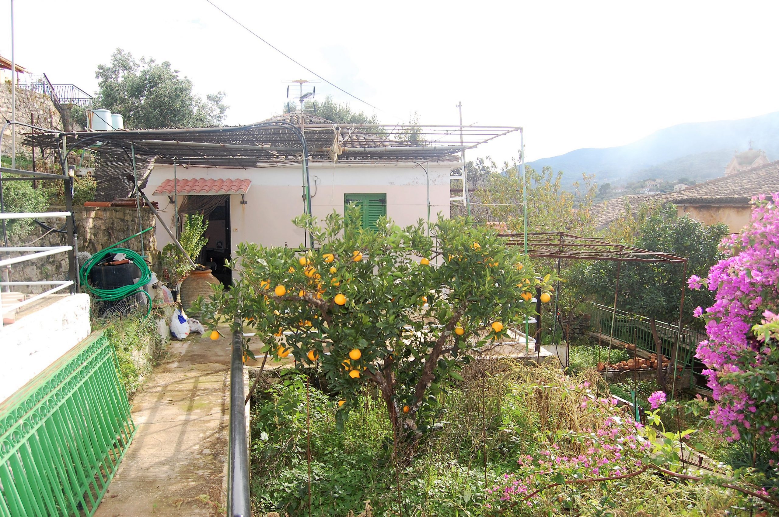 Outside terrace and garden of house for sale in Ithaca Greece, Vathi
