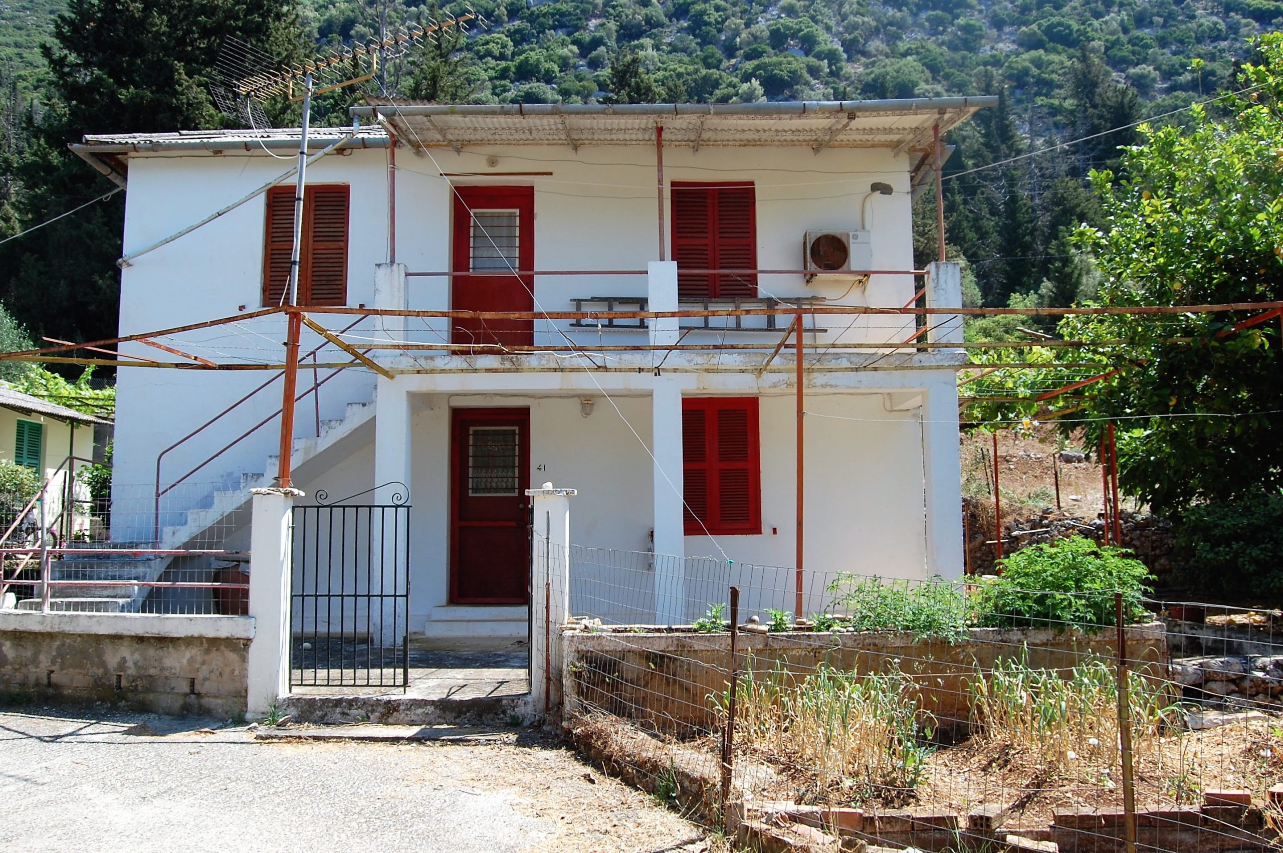 Exterior facade of house for sale in Ithaca Greece, Lefki