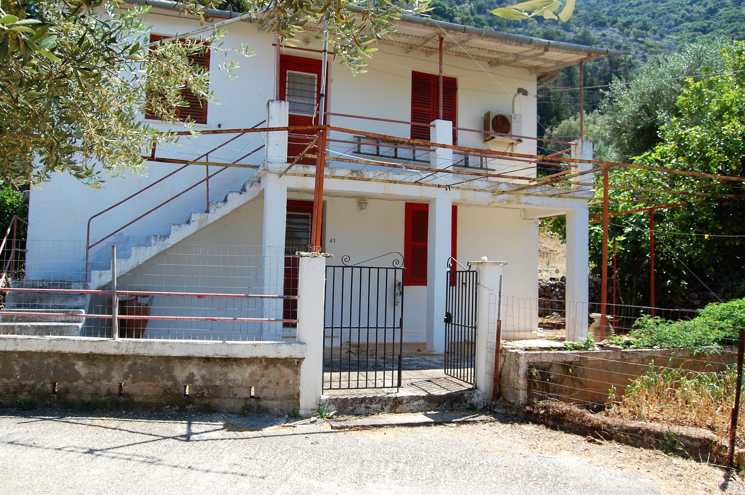 Exterior facade of house for sale in Ithaca Greece, Lefki