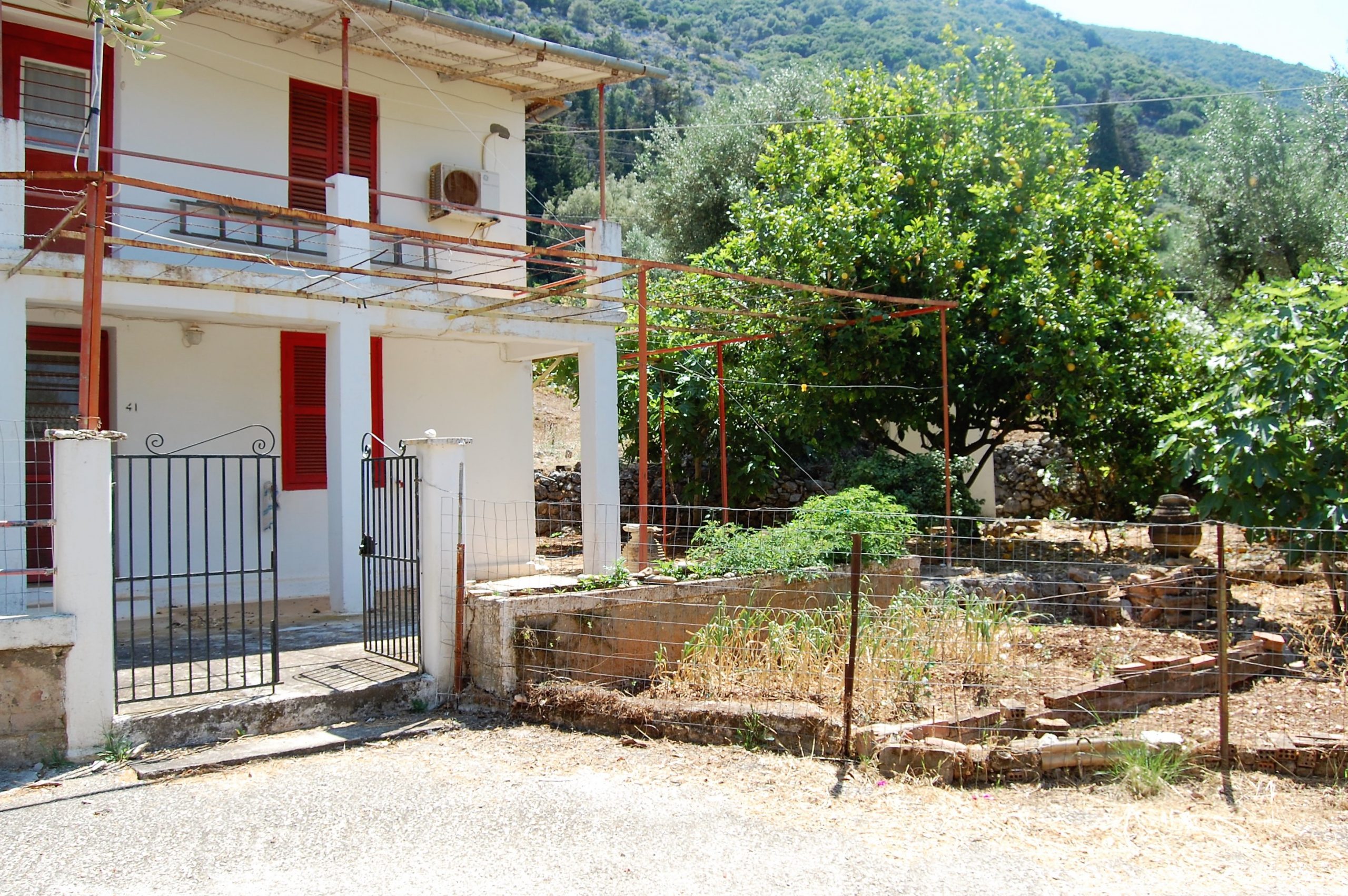 Exterior facade of house for sale in Ithaca Greece, Lefki