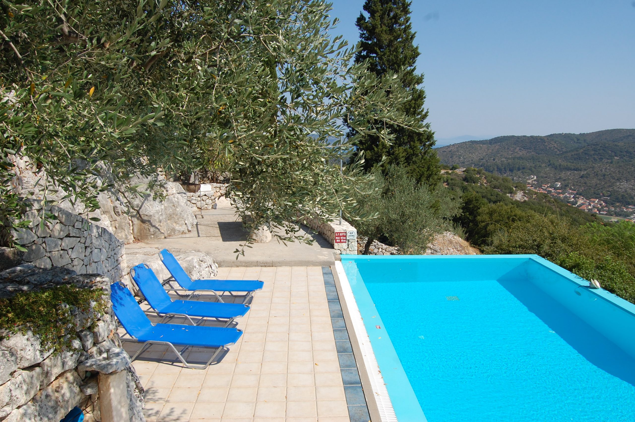 Pool area of house for sale in Ithaca Greece, Perachori
