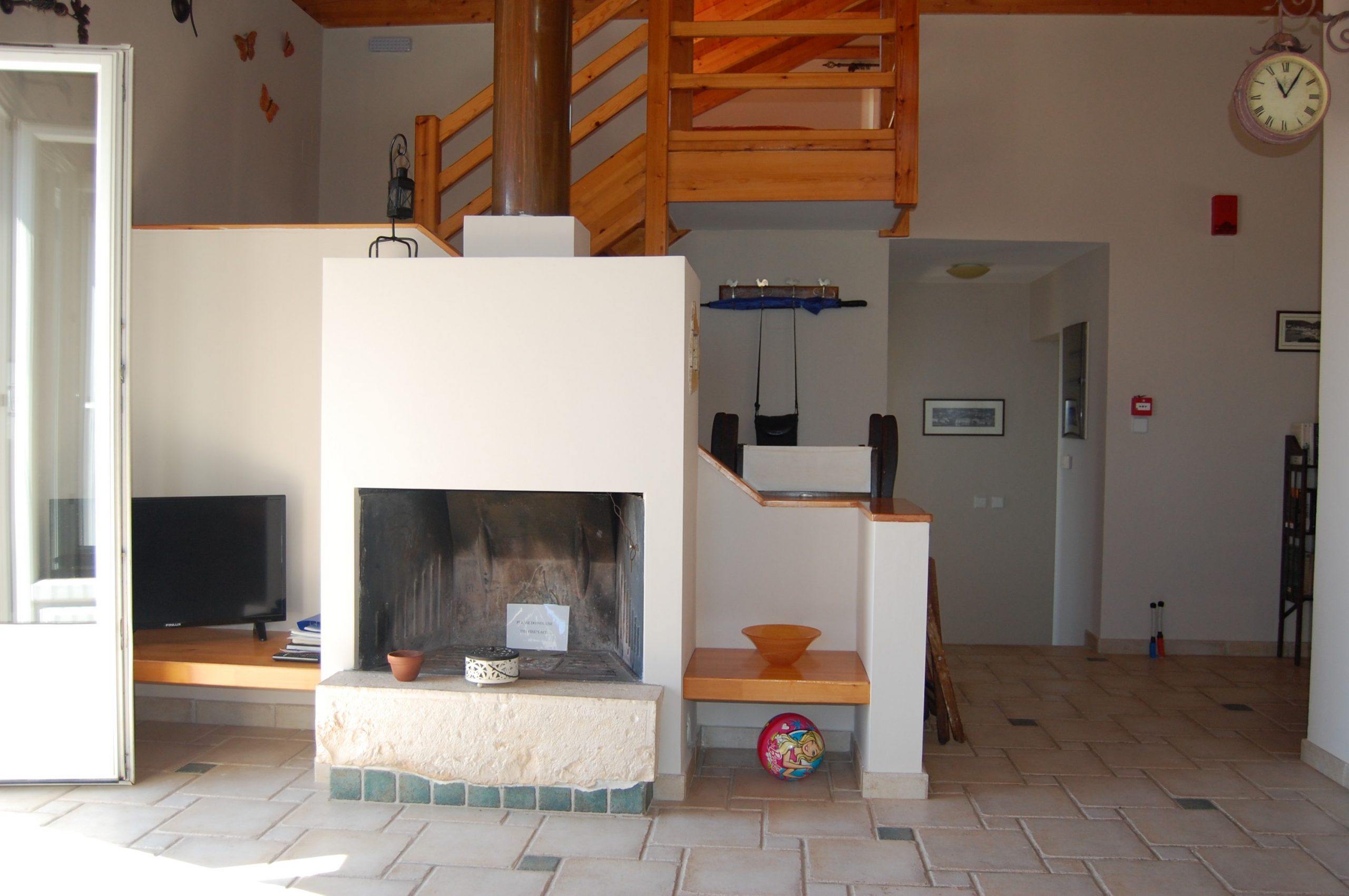Living area with open fire of villa with pool for sale in Ithaca Greece, Perachori