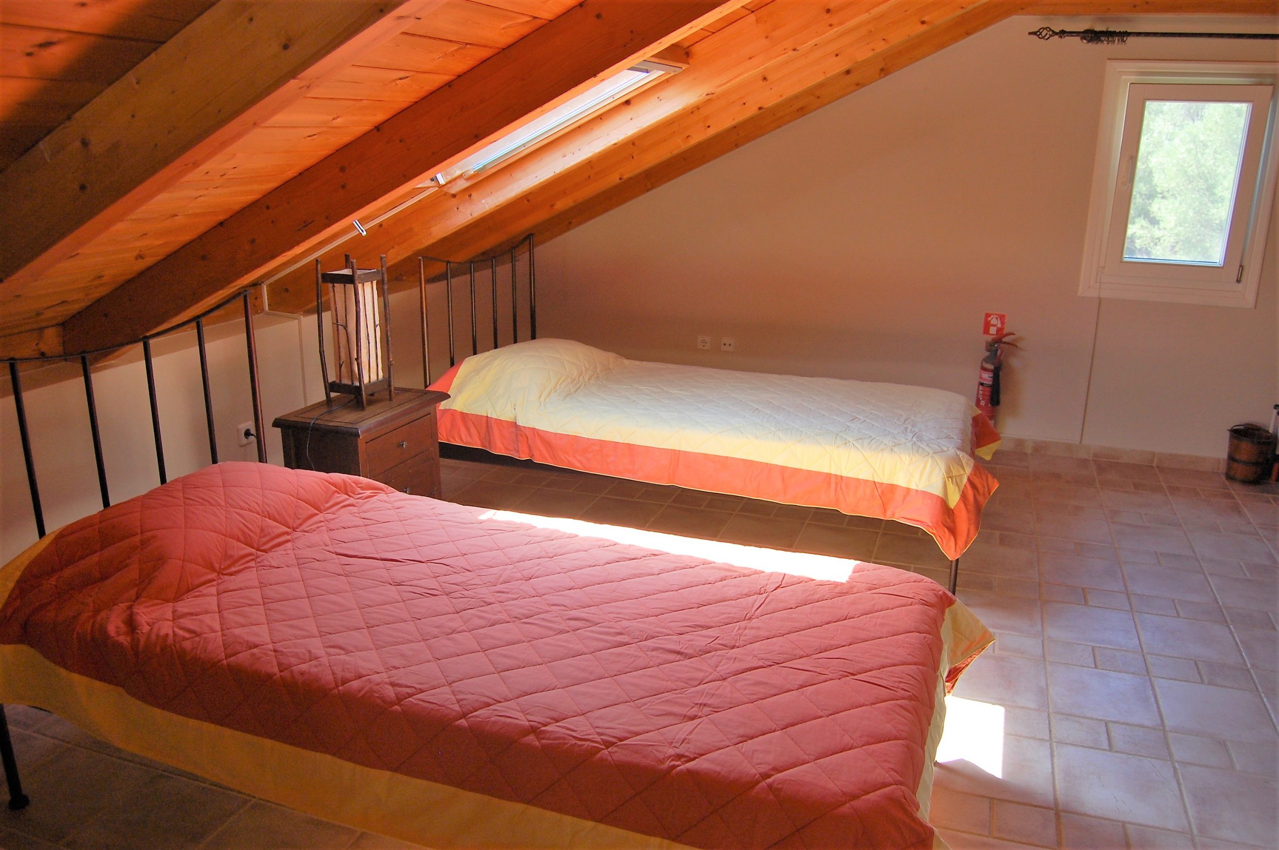 Attic twin bedroom of house with pool for sale in Ithaca Greece, Perachori
