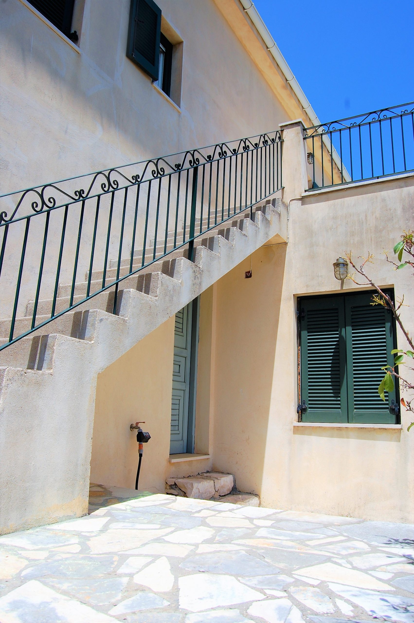 Rear outside staircase of house for sale in Ithaca Greece, Perachori