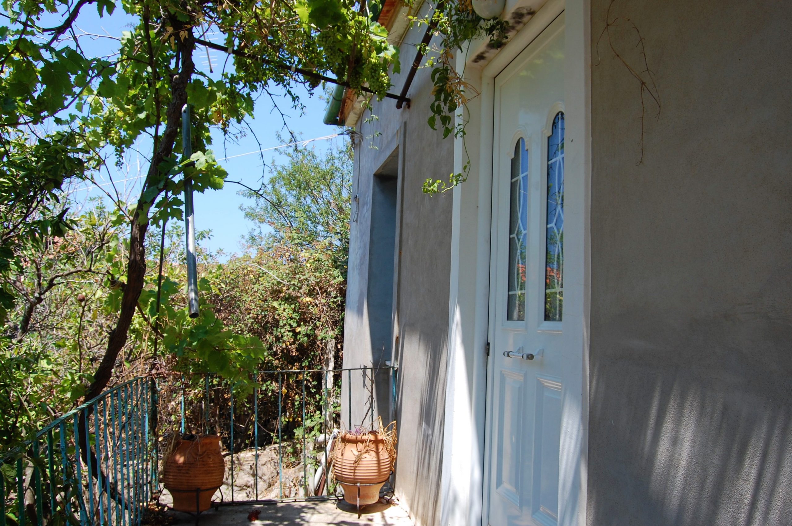 Front door of house for sale in Ithaca Greece Vathi