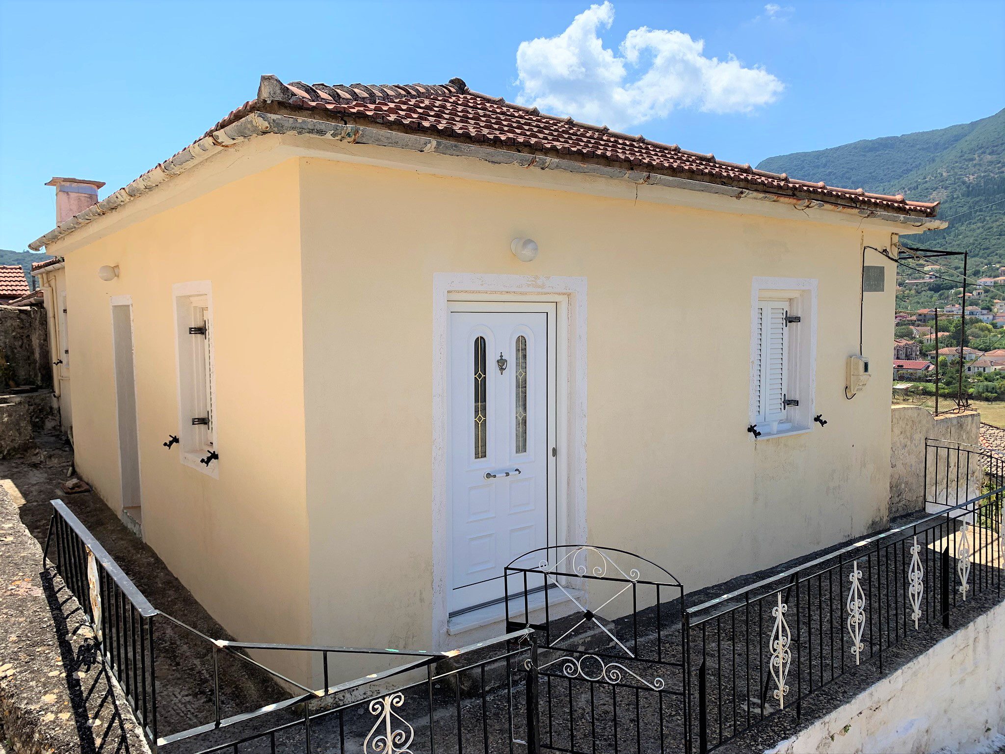 Exterior facade of house for sale in Ithaca Greece, Vathi