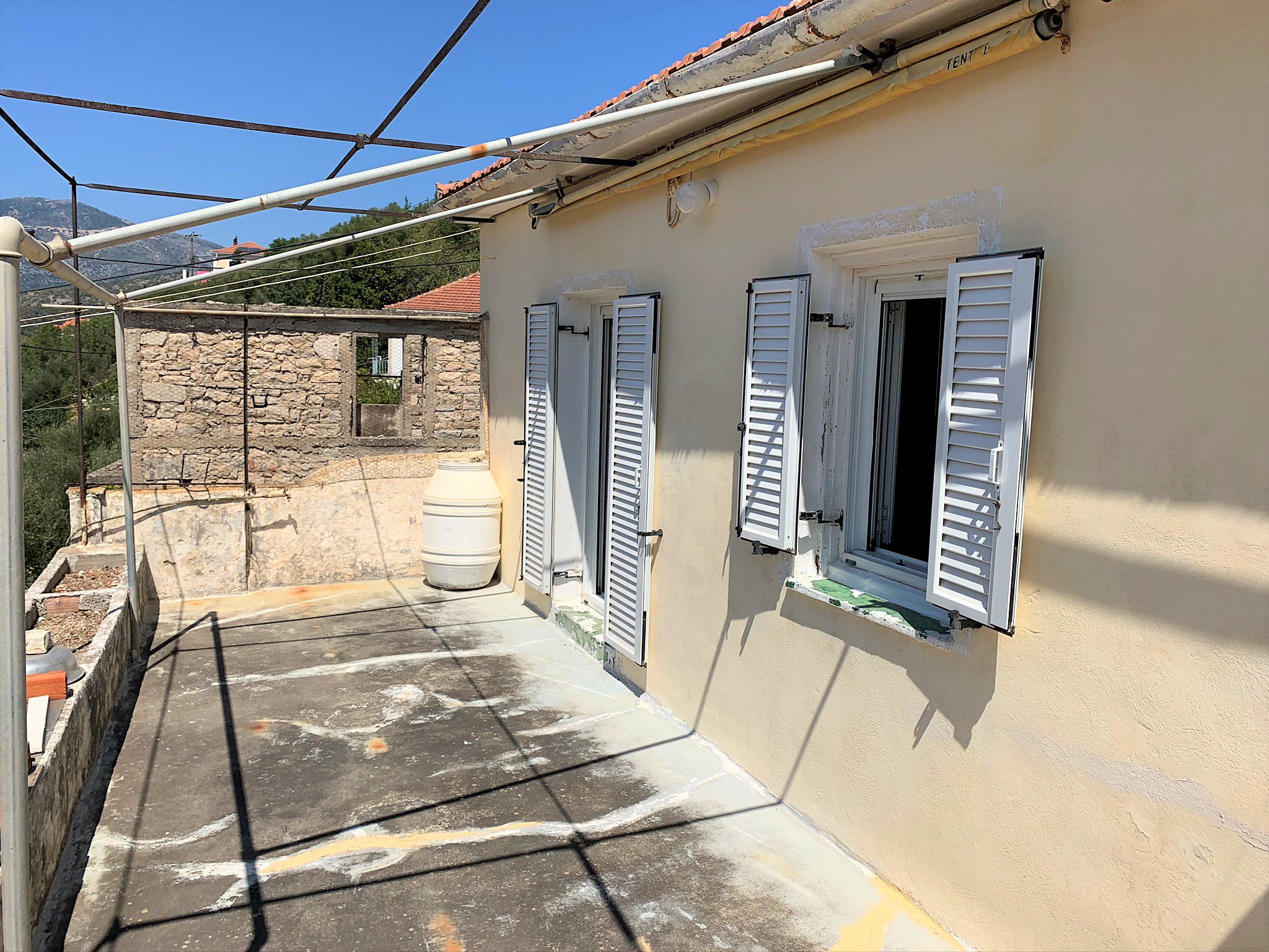 Exterior facade of house for sale in Ithaca Greece, Vathi