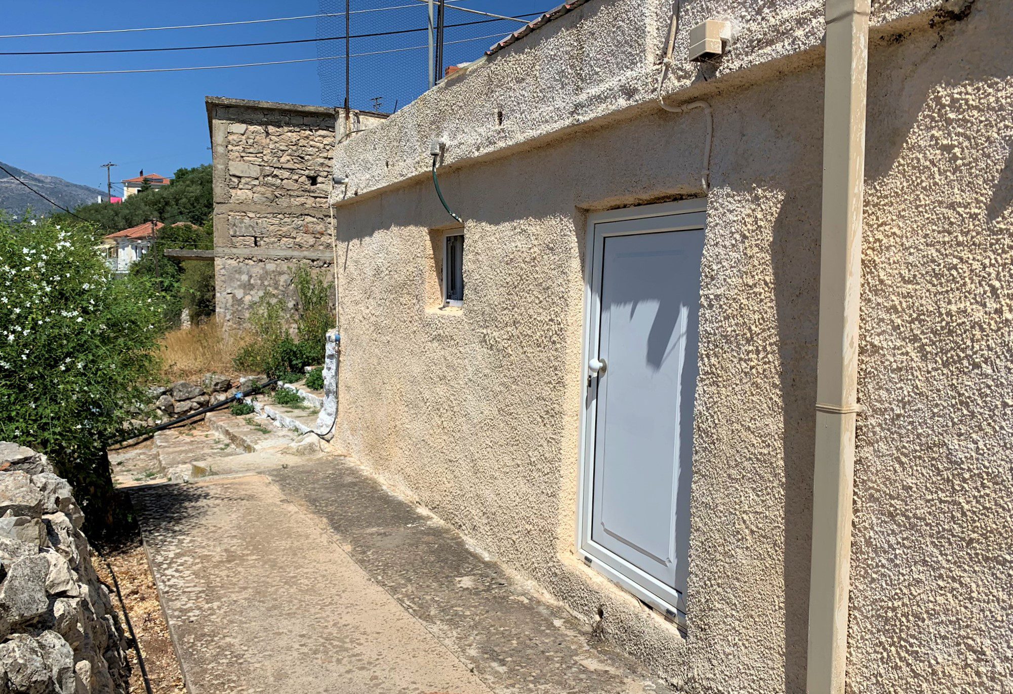 Exterior facade of house for sale in Ithaca Greece, Vathi