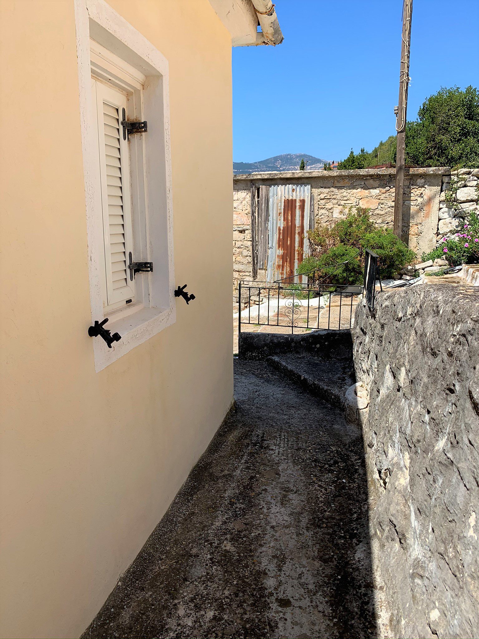 Exterior facade of house for sale in Ithaca Greece, Vathi