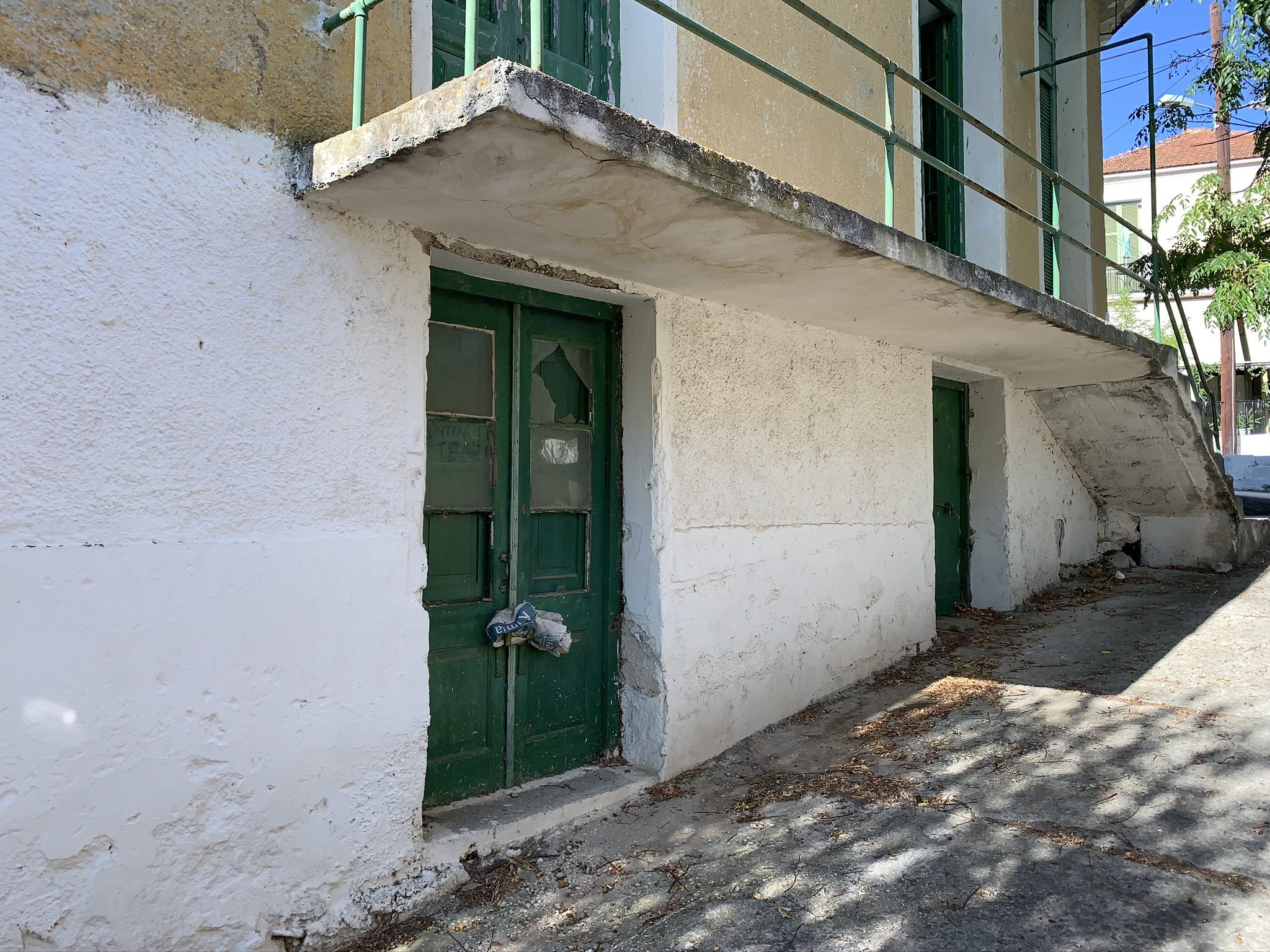 Exterior façade of commercial space with storerooms for sale in Ithaca Greece, Stavros