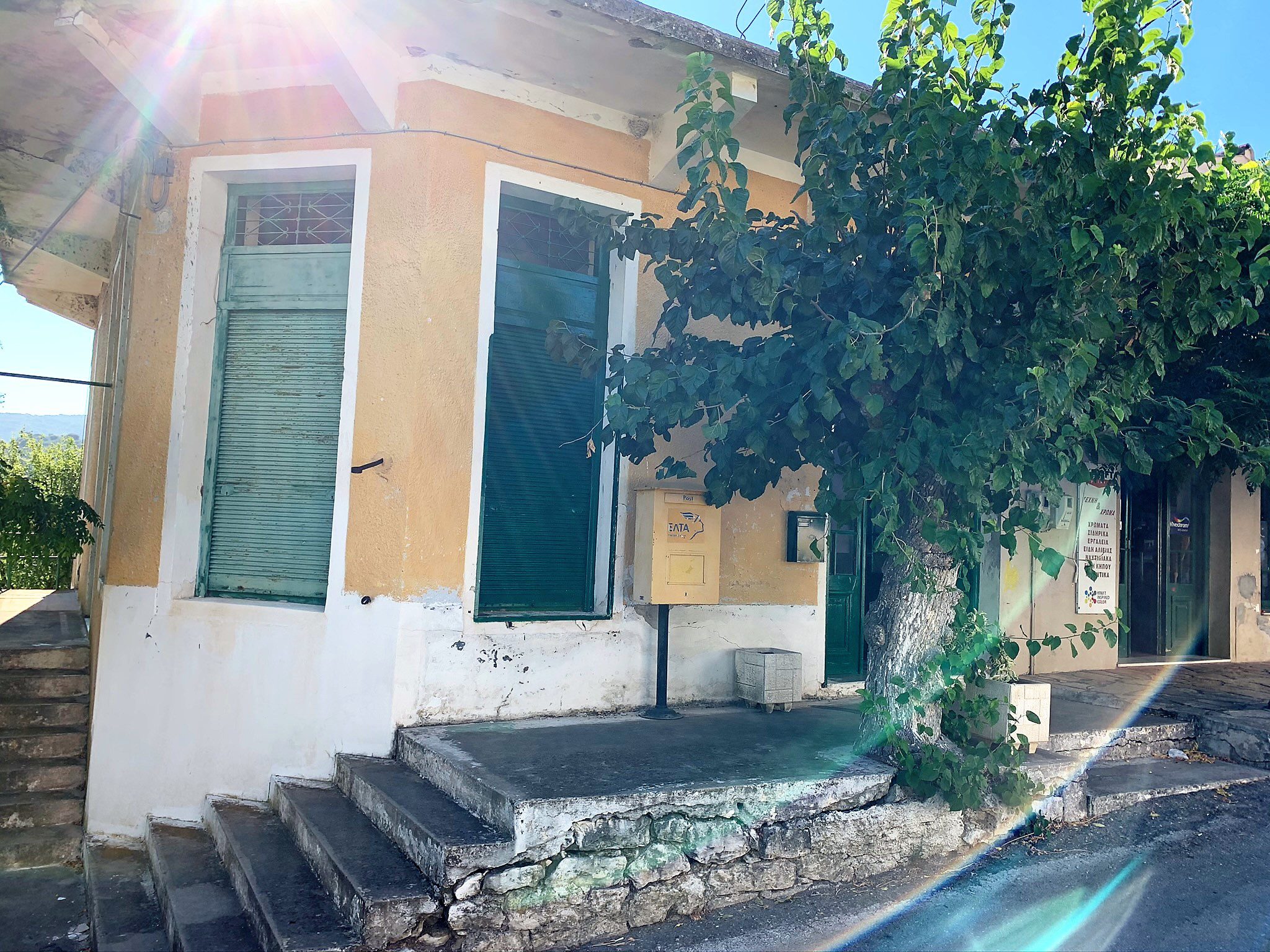 Exterior façade and shop front to commercial space for sale in Ithaca Greece, Stavros
