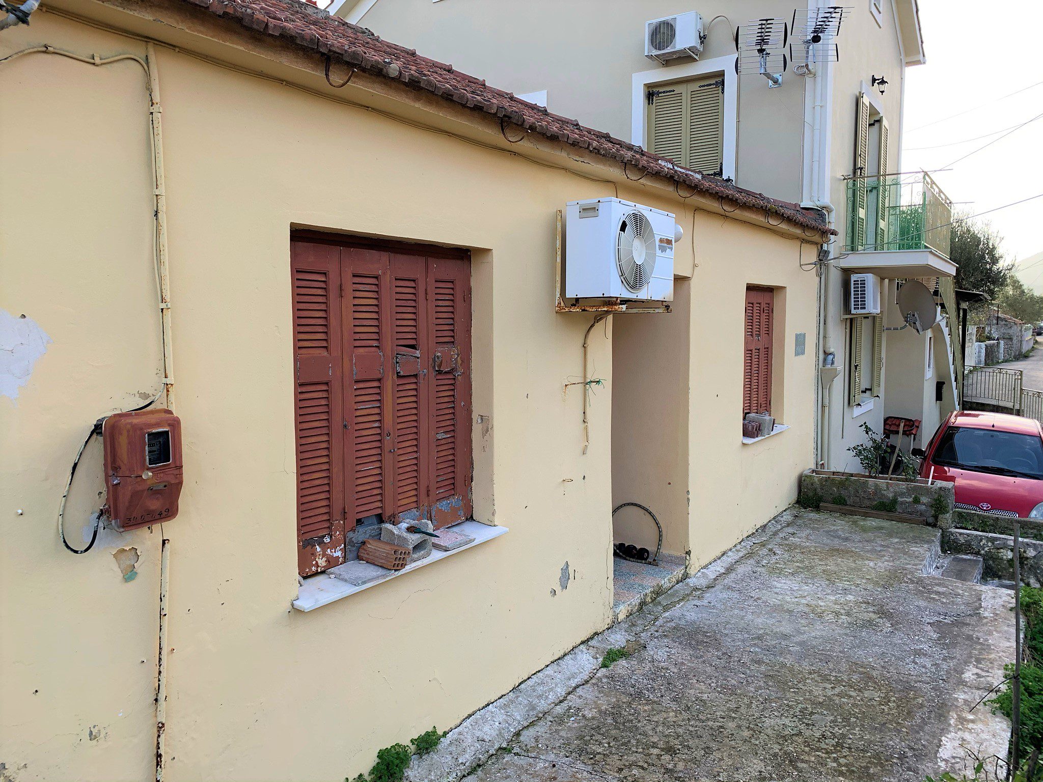 Exterior facade of house for sale in Ithaca Greece, Vathi