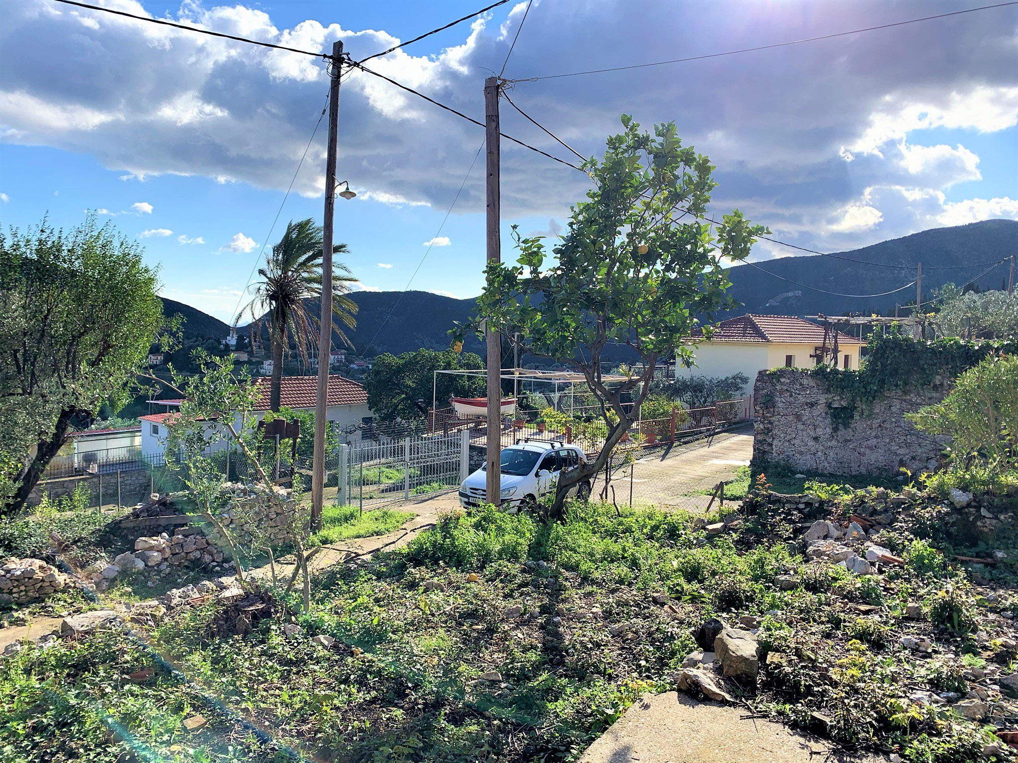 Garden and view of house for sale in Ithaca Greece Kolleri