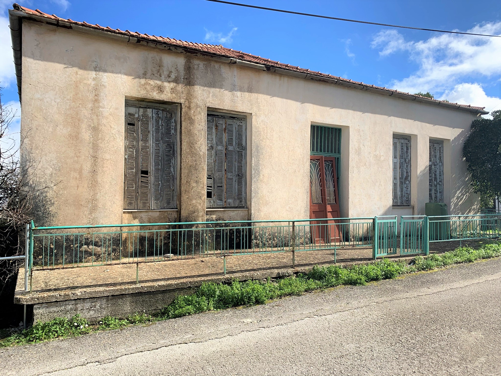 Exterior facade of house for sale in Ithaca Greece Anogi