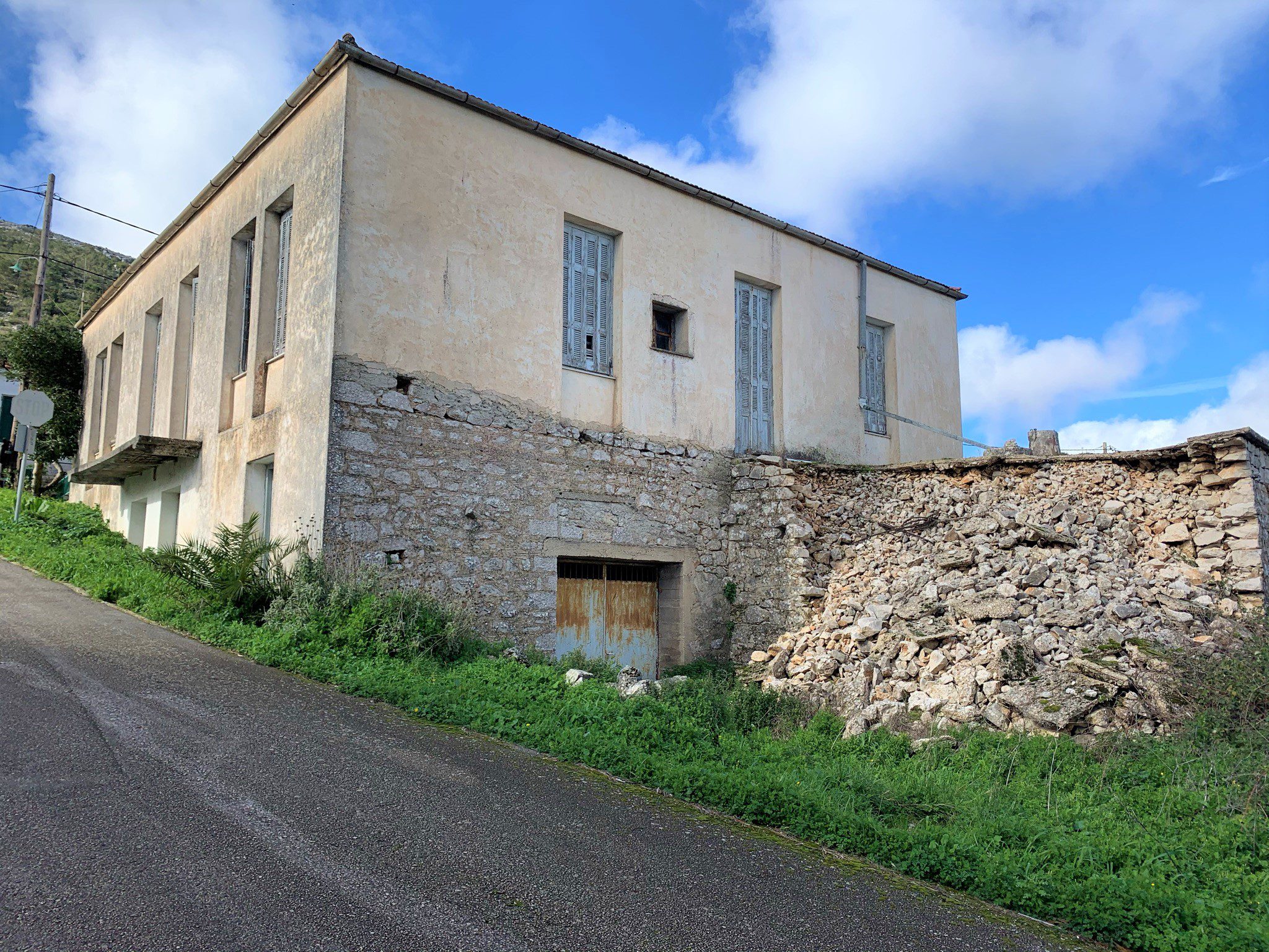 Exterior facade of house for sale in Ithaca Greece Anogi