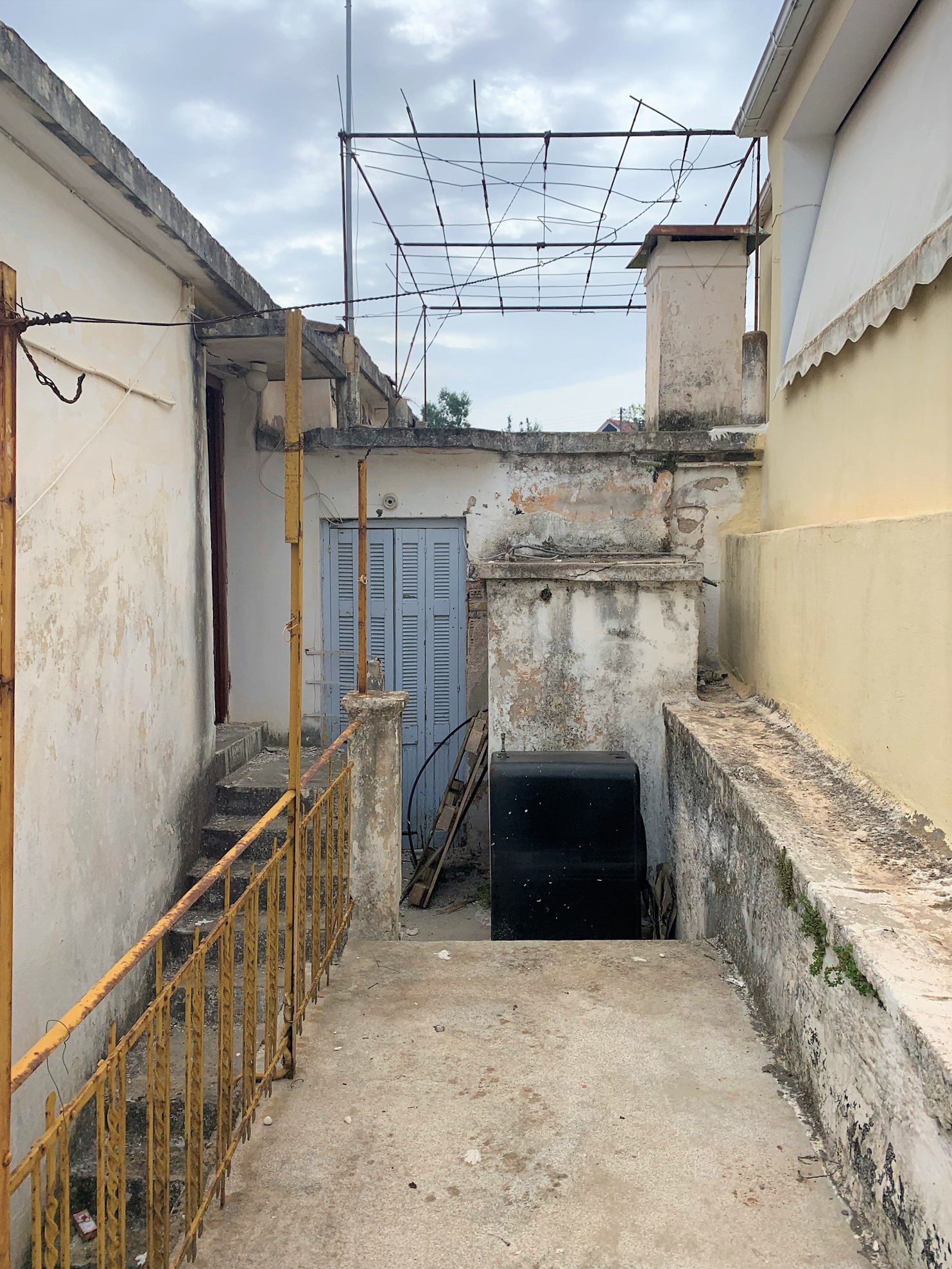 Outside staircase of house for sale in Ithaca Greece Vathi