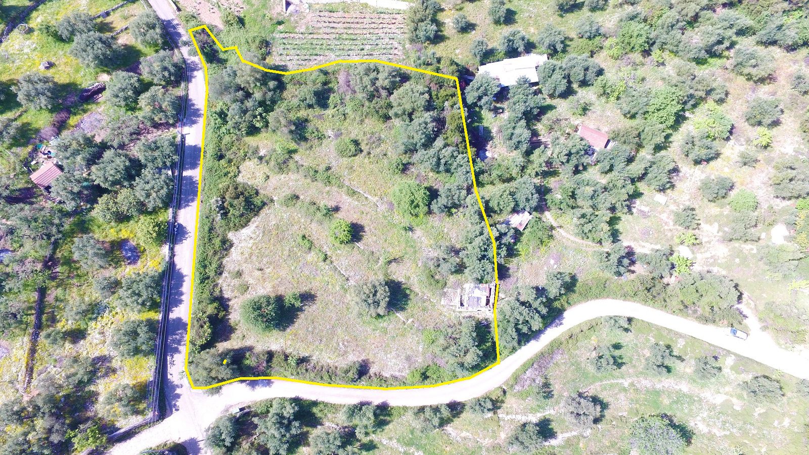Aerial view of land with building license for sale in Ithaca Greece, Perachori