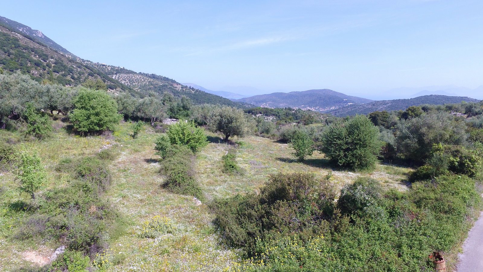 Aerial views of land with building license for sale in Ithaca Greece, Perachori