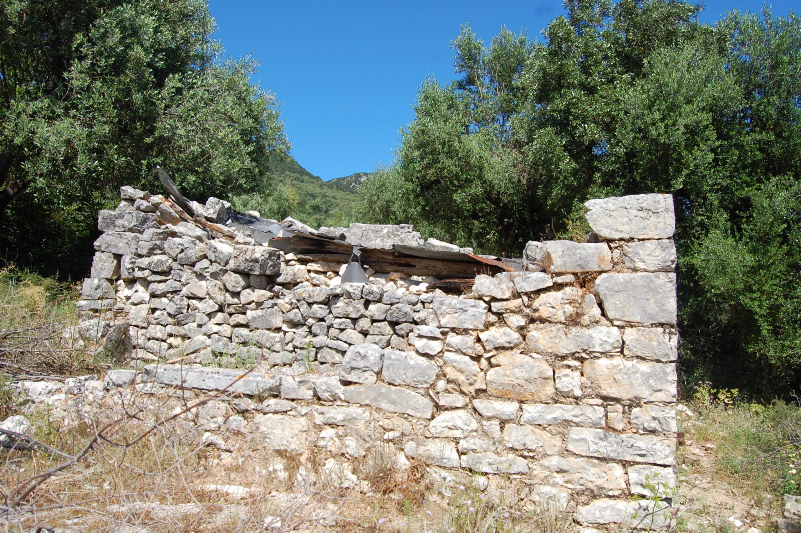 Stone water tank on land for sale in Ithaca Greece, Perachori