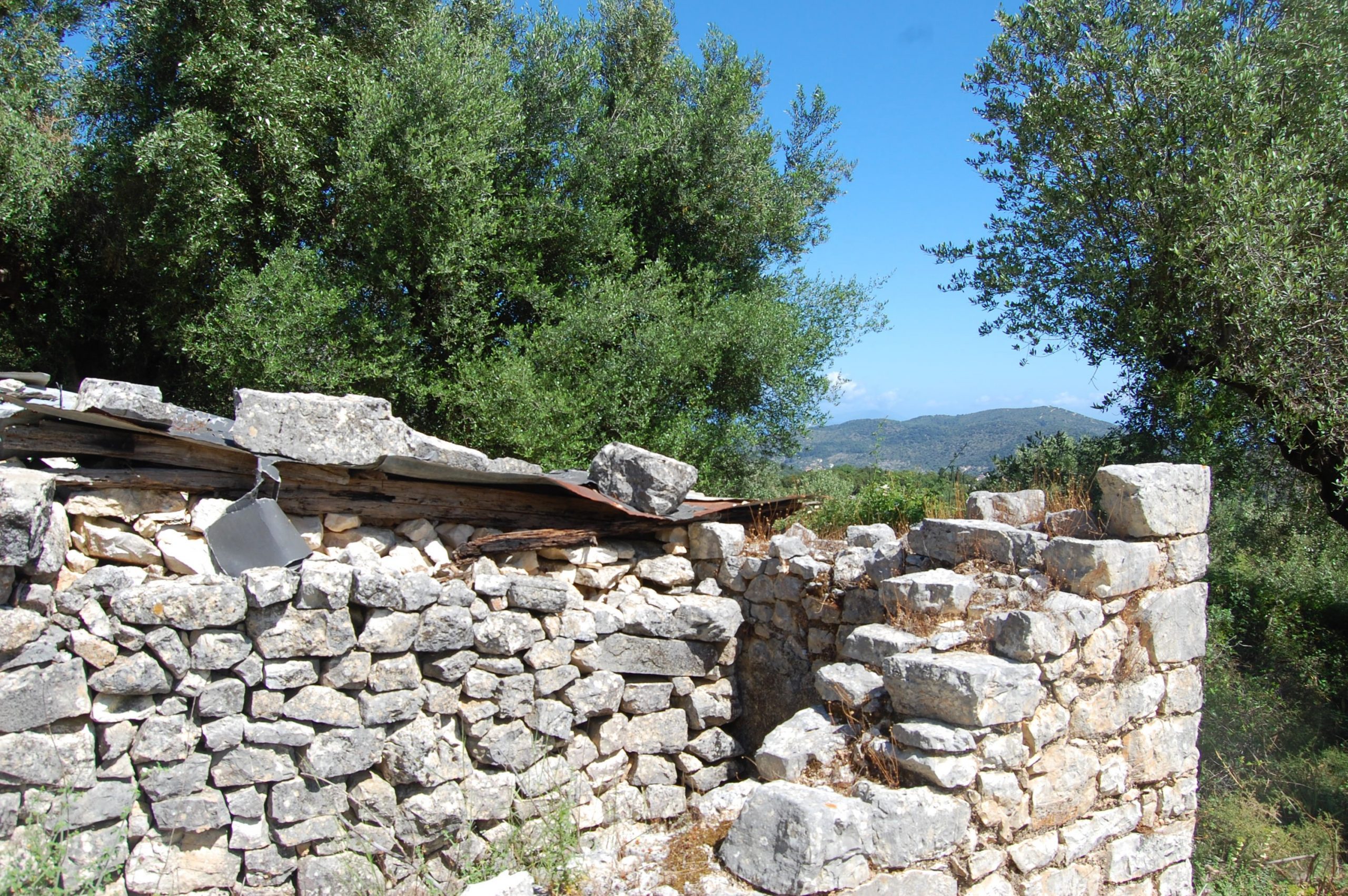 Stone water tank on land with building permit for sale in Ithaca Greece, Perachori