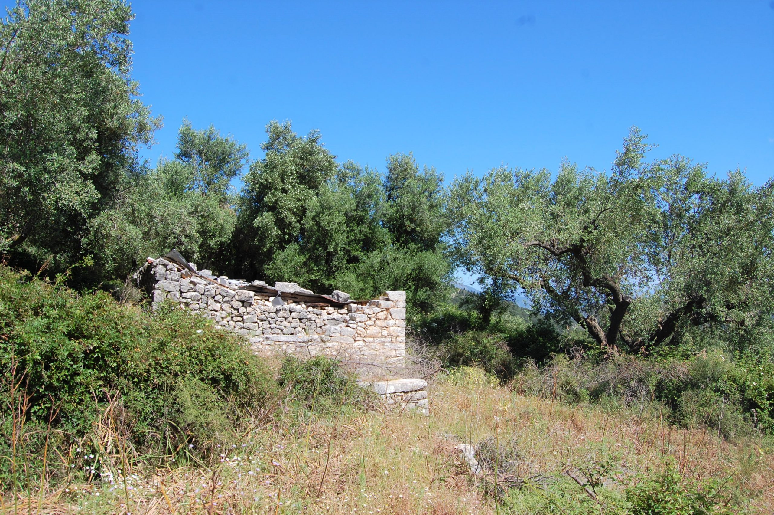 Stone water tank of land with building license for sale in Ithaca Greece, Perachori