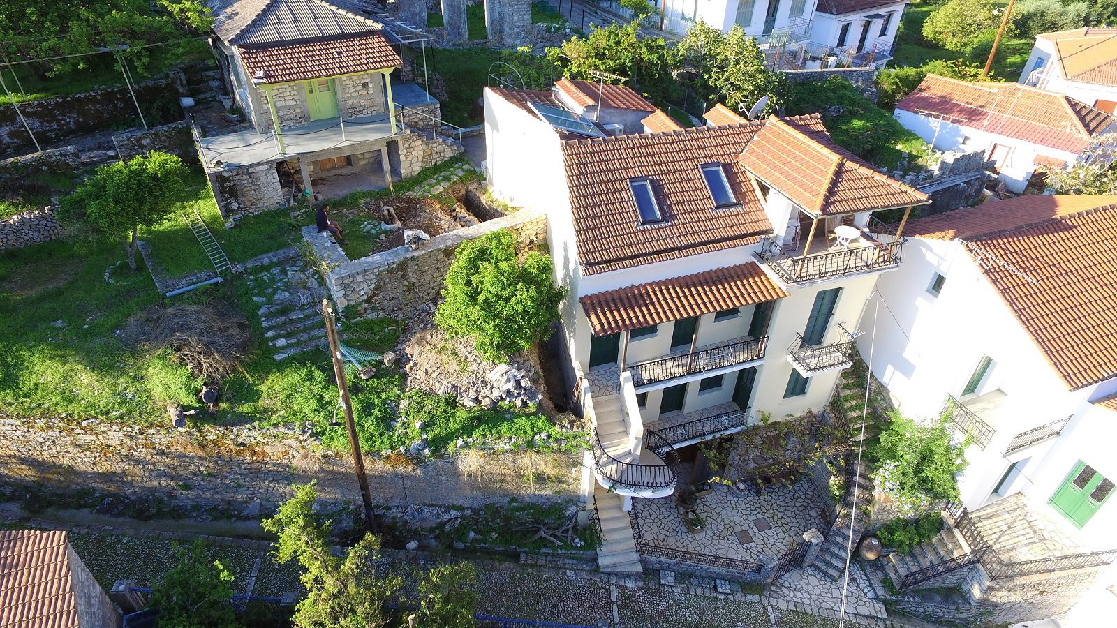 Aerial views of apartment complex and house for sale in Ithaca Greece, Kioni