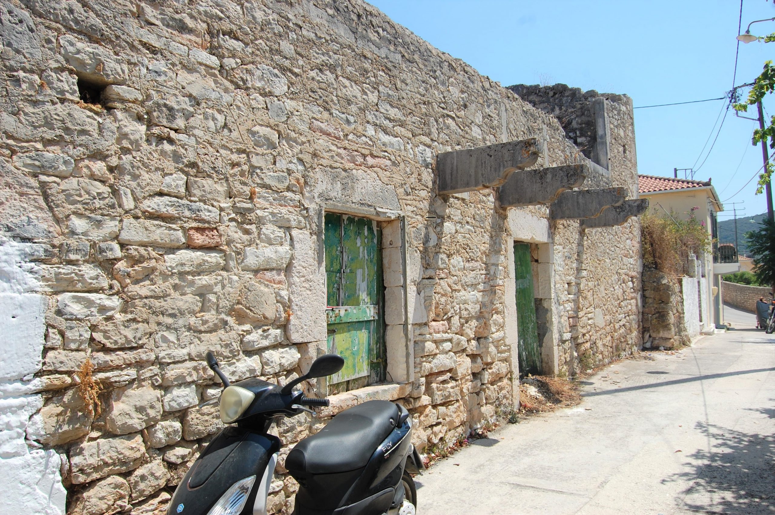 Exterior facade and terrace of ruin for sale in Ithaca Greece, Vathi