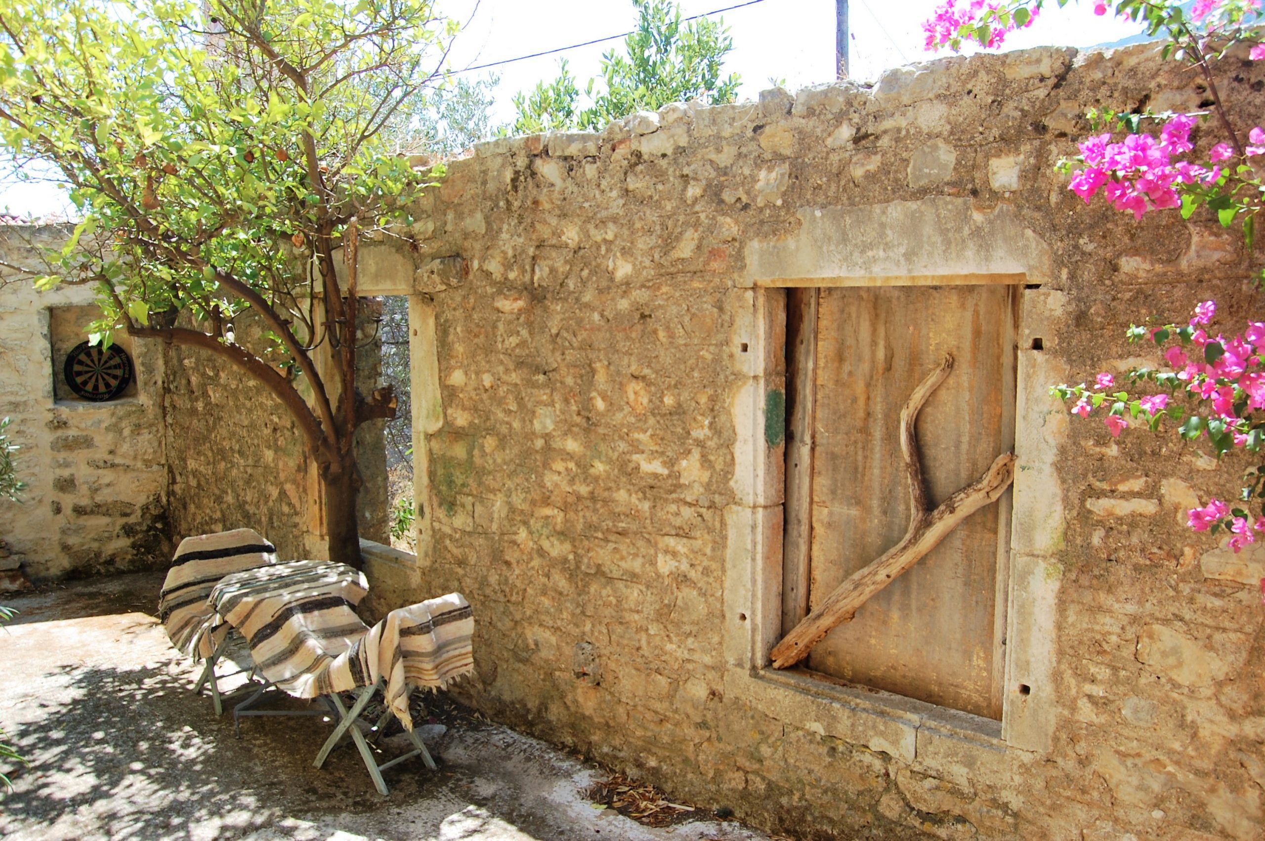 Exterior facade and terrace of ruin for sale in Ithaca Greece, Vathi