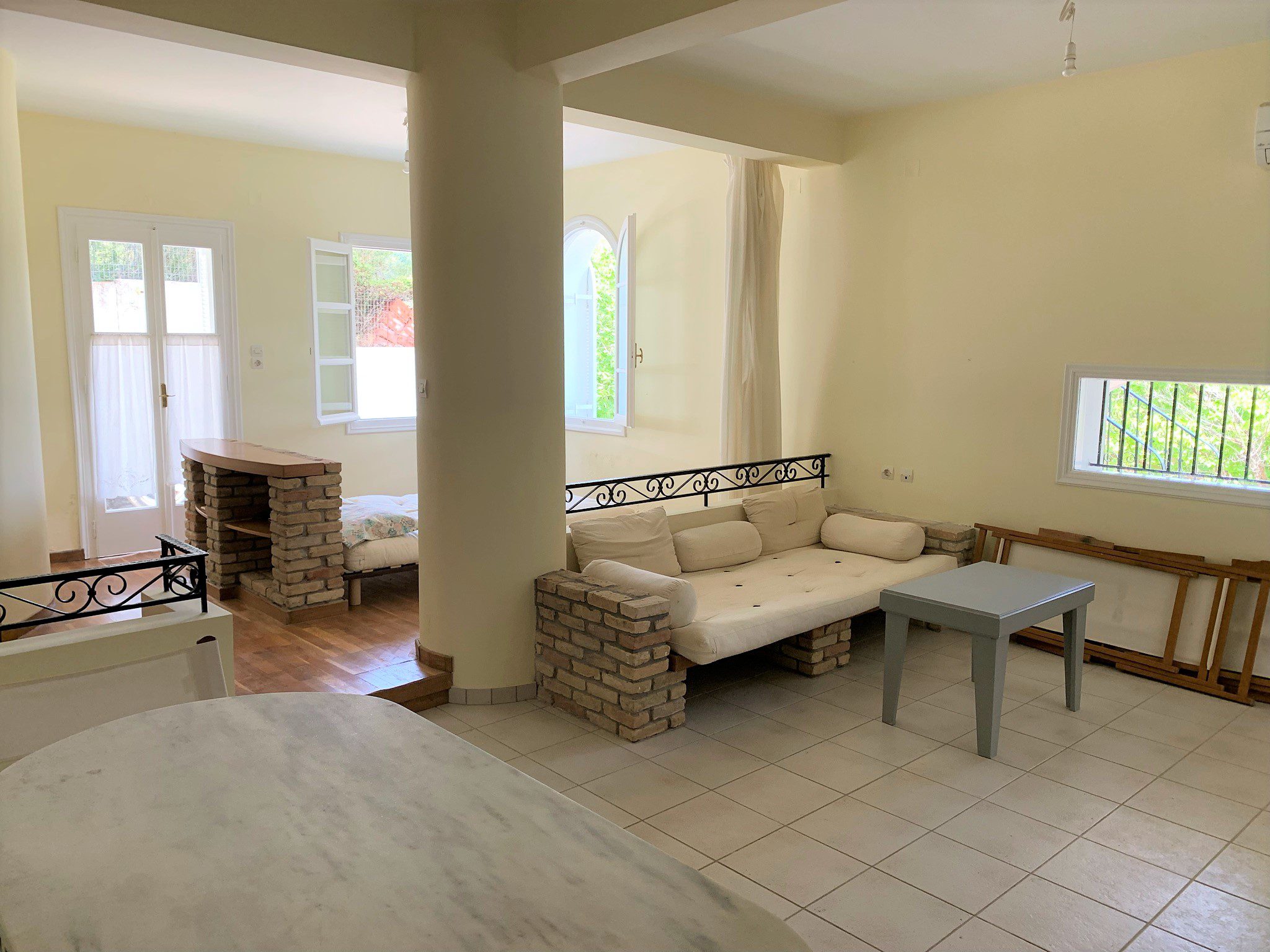 Living room of studio below house for sale Ithaca Greece, Aetos