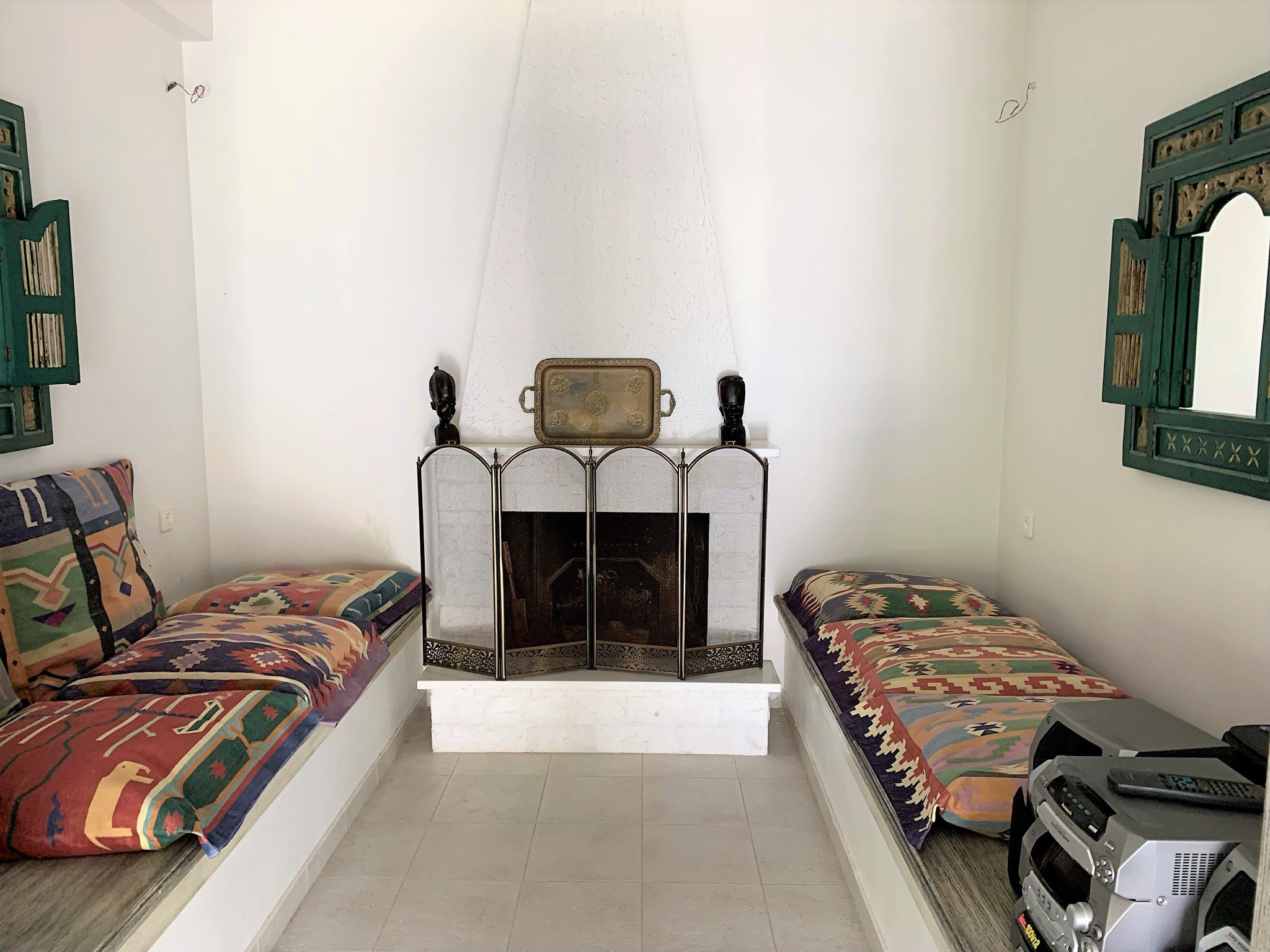Living room with fireplace of house for sale Ithaca Greece, Aetos