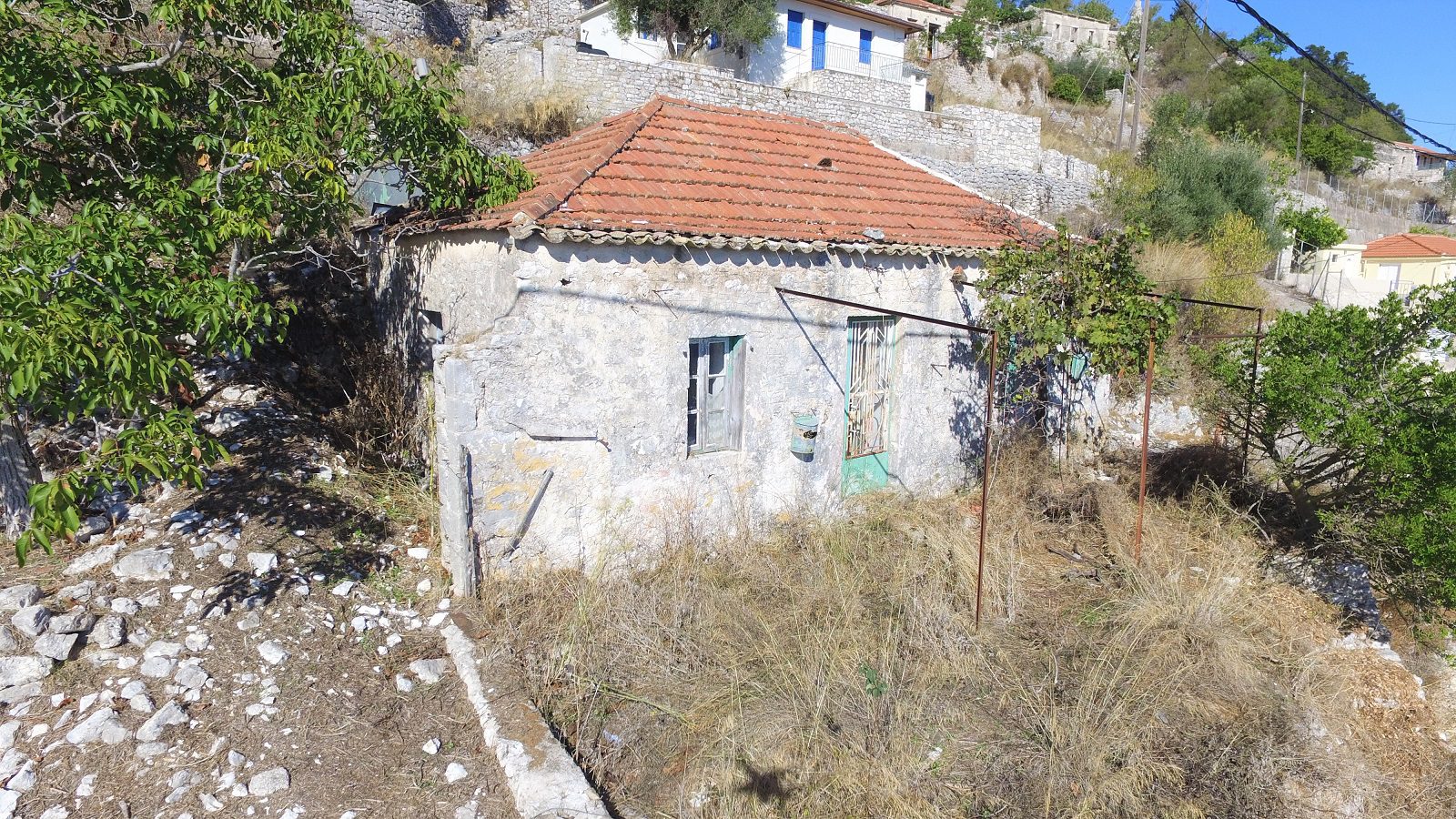 View from distance of house for sale Ithaca Greece, Exoghi