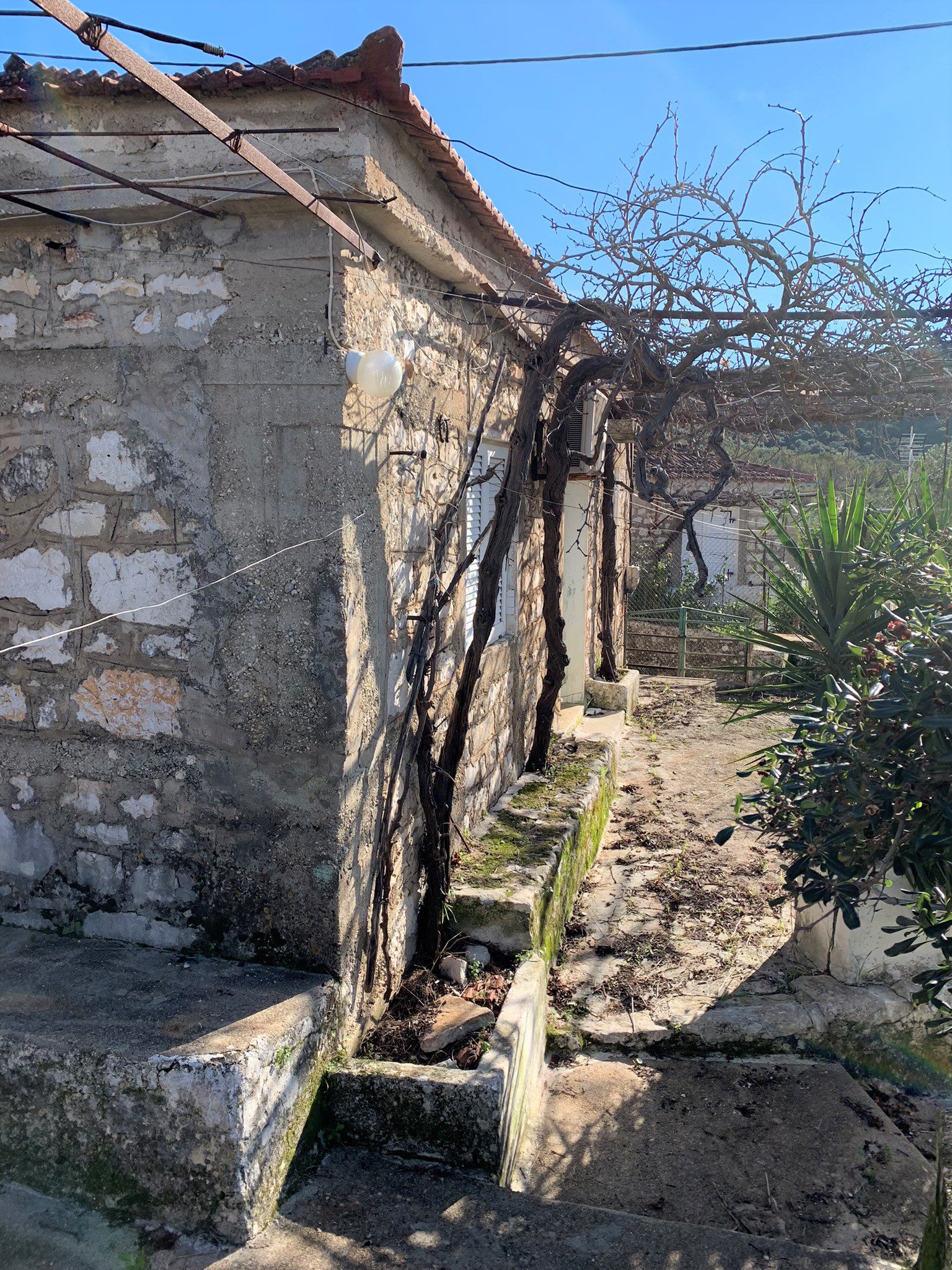 Side spaces of house for sale on Ithaca Greece, Vathi