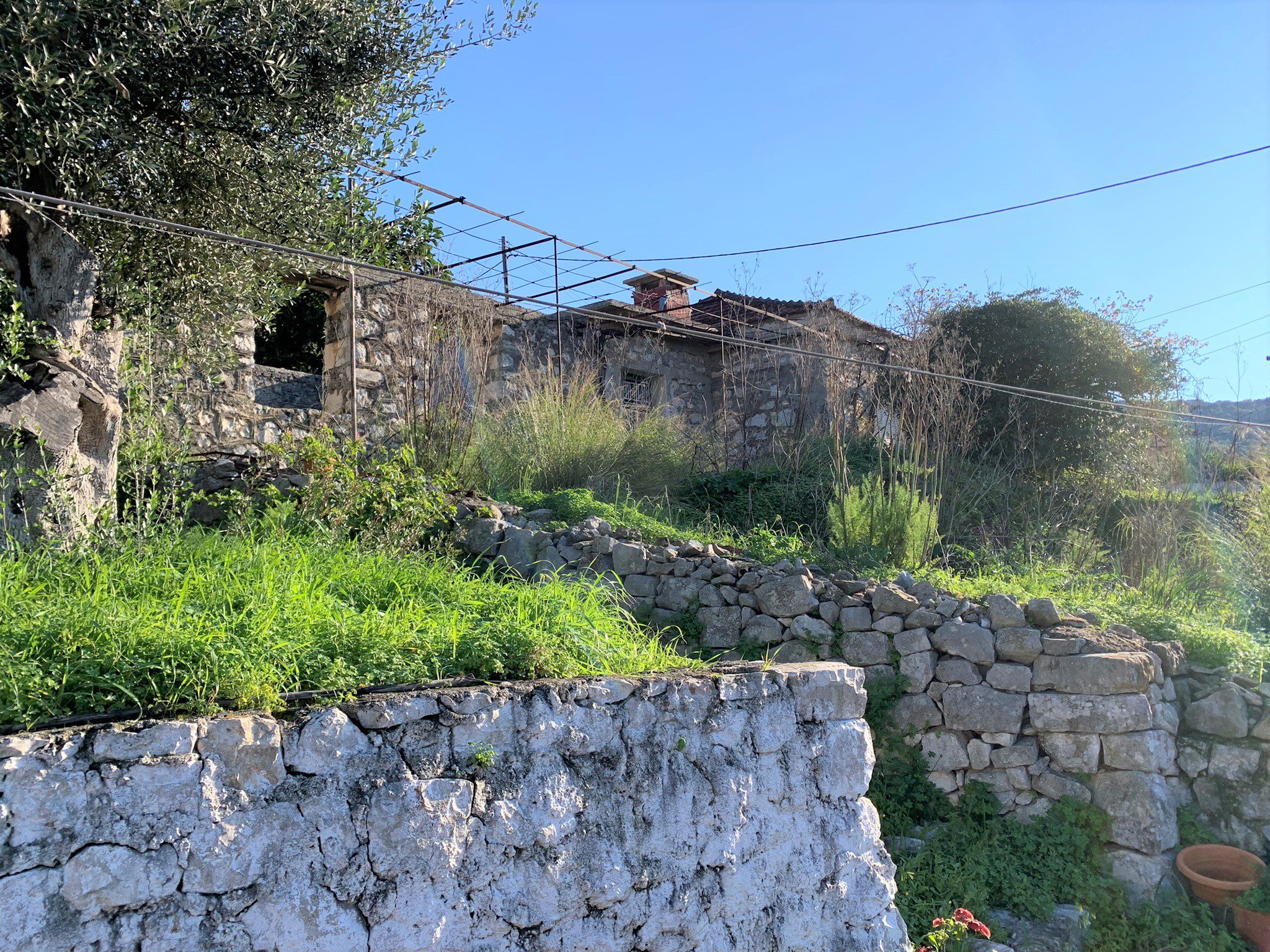 Stone walls around the house for sale on Ithaca Greece, Vathi