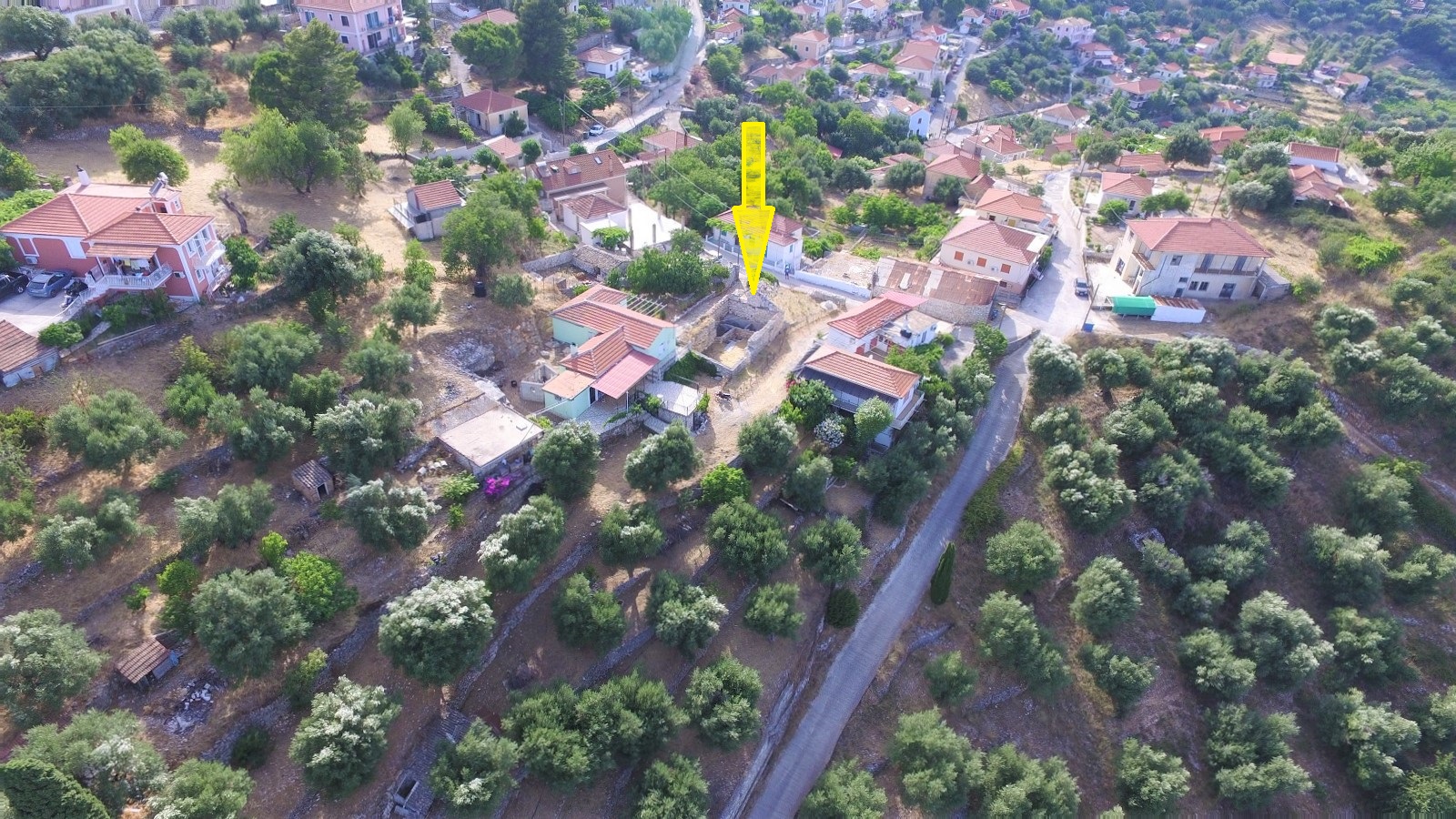 Aerial views of land with ruin for sale on Ithaca Greece, Perachori