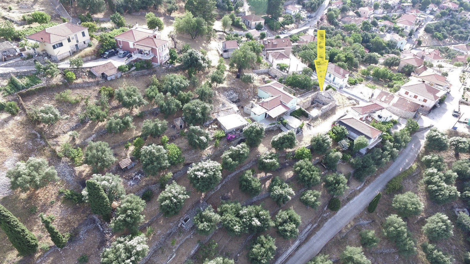 Aerial views of land with ruin for sale on Ithaca Greece, Perachori