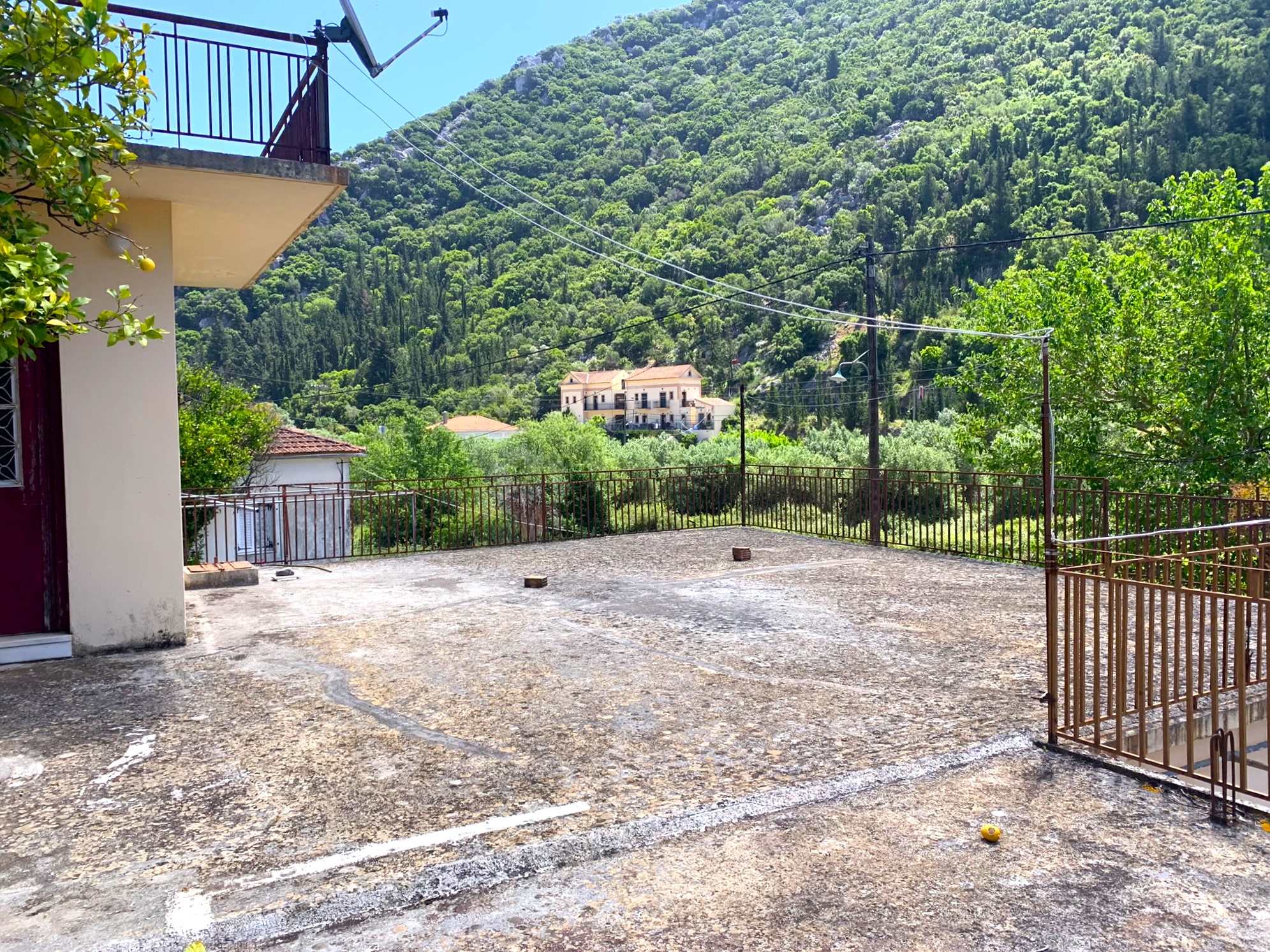 Outdoor spaces and views of house for sale on Ithaca Greece, Frikes
