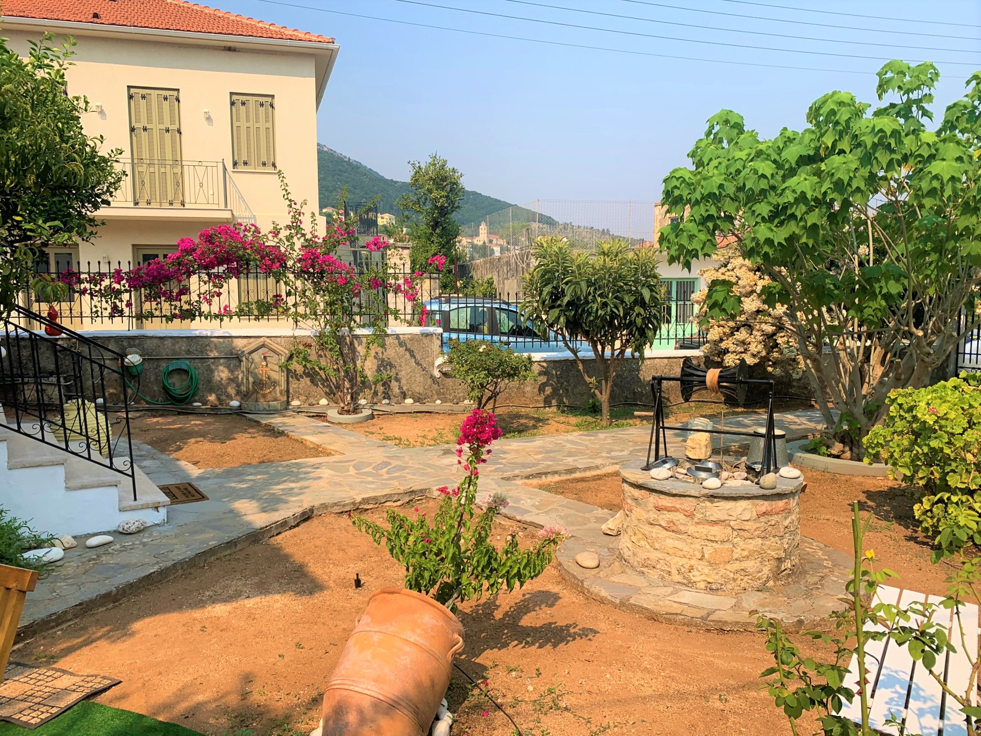 Patio with water well of house for sale on Ithaca Greece, Vathi