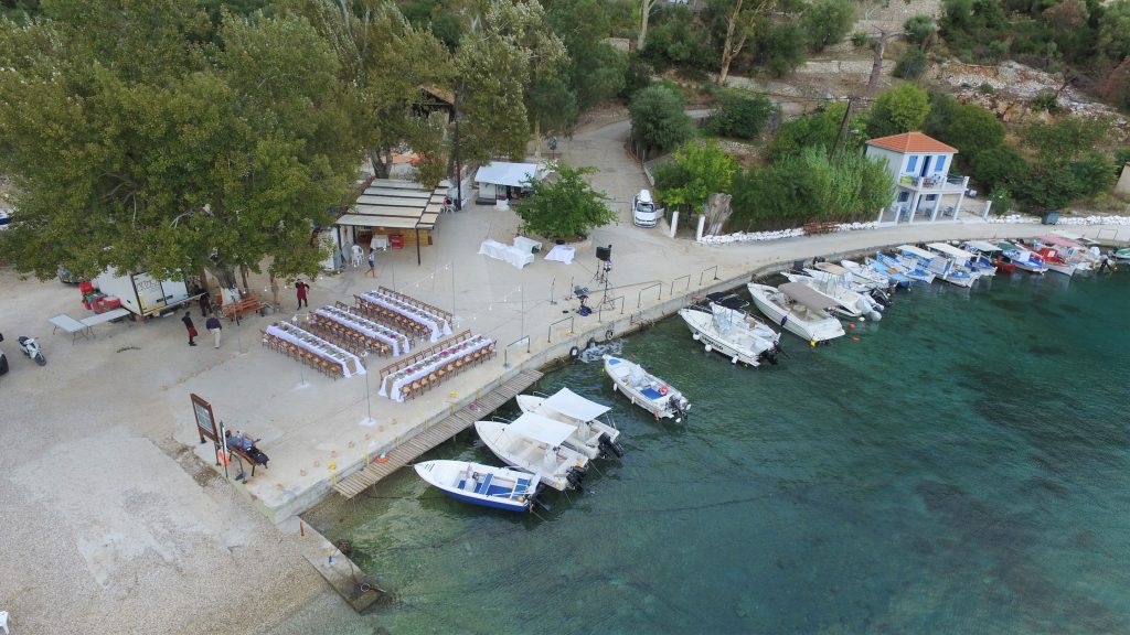 Drone pic, arrangements for wedding reception on seafront, Ithaca Greece