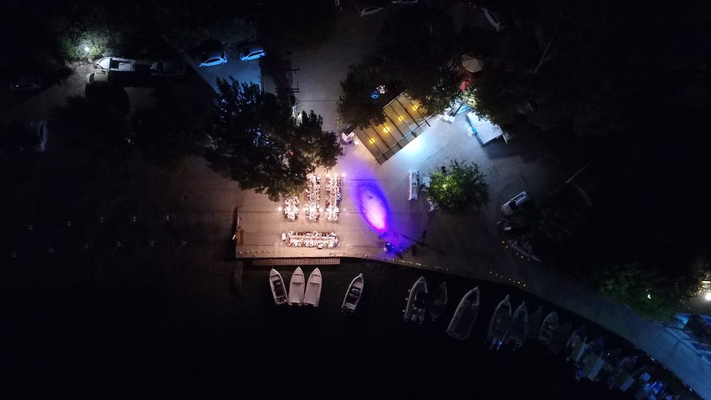 Drone pic of wedding reception on seafront, Ithaca Greece