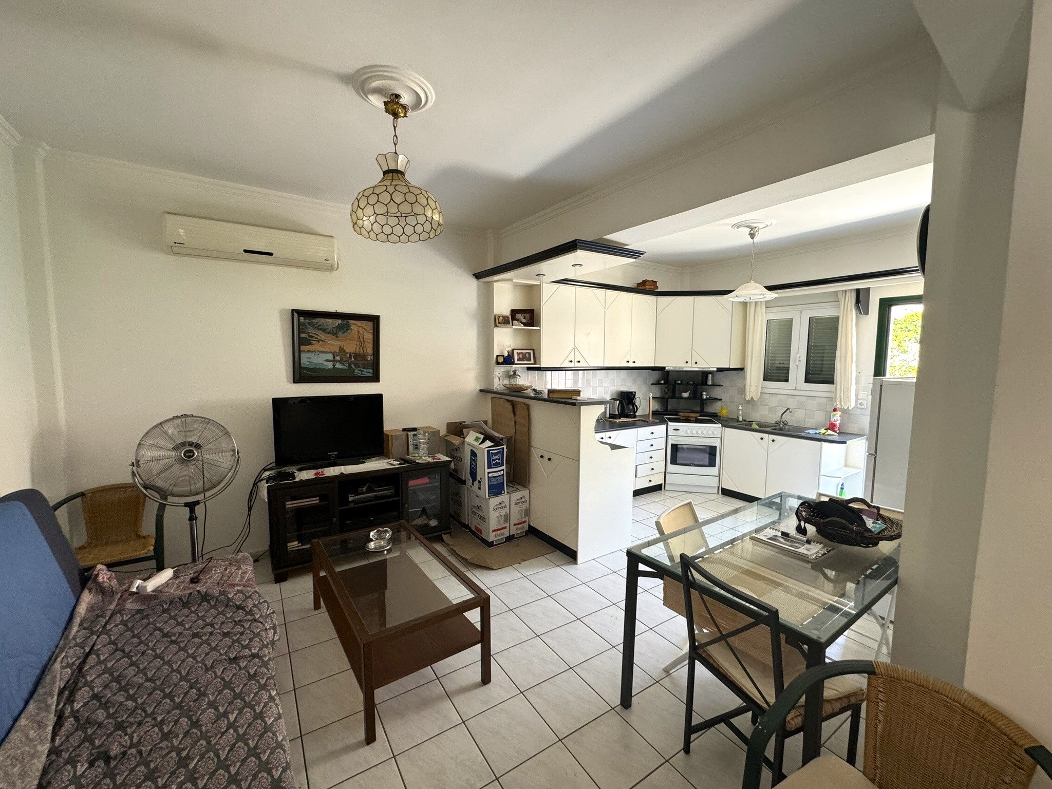 Kitchen and lounge of house for sale in Ithaca Greece Vathi