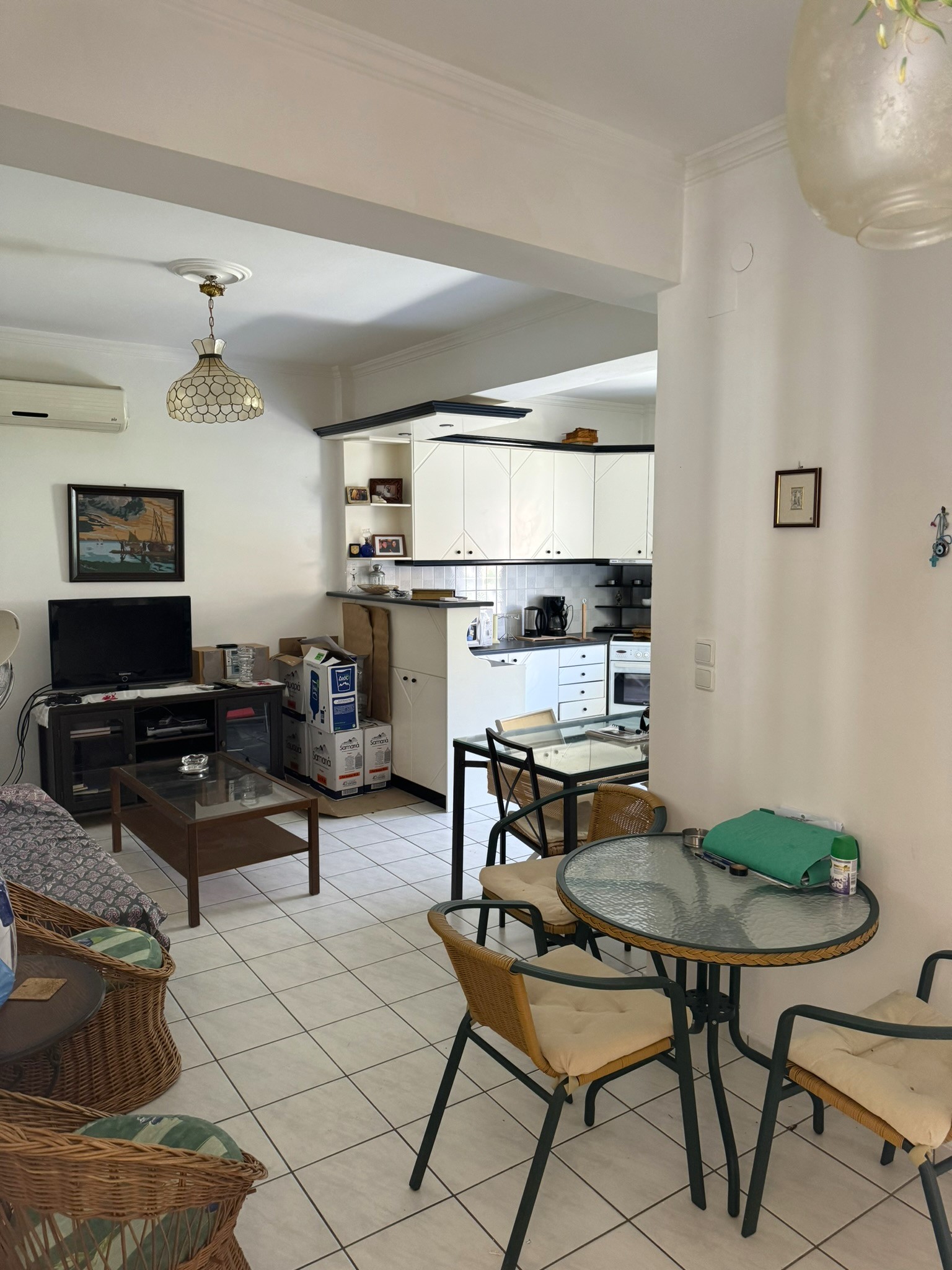 Kitchen and lounge of house for sale in Ithaca Greece Vathi