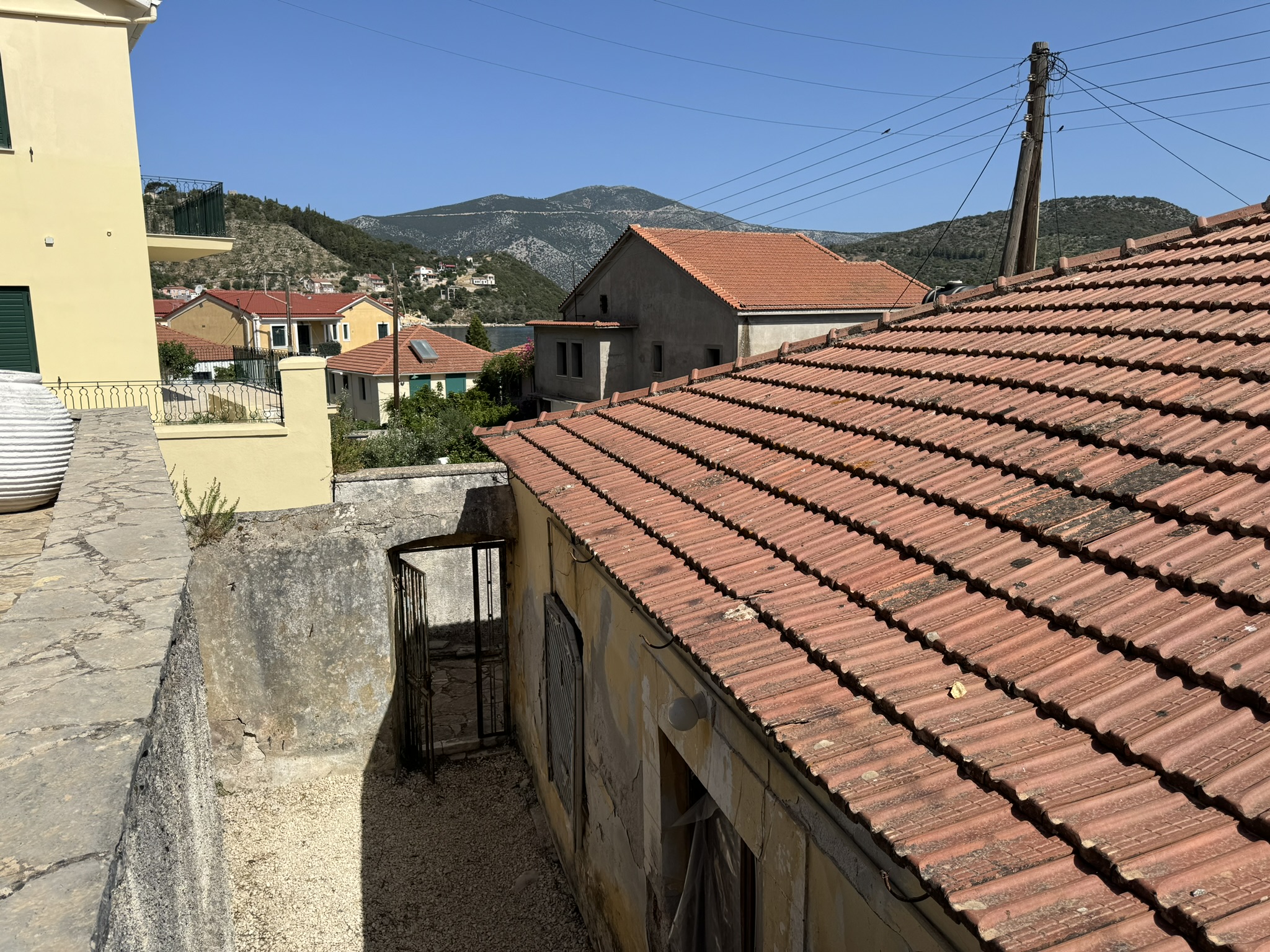 Gate and back courtyard of house for sale in Ithaca Greece Vathi