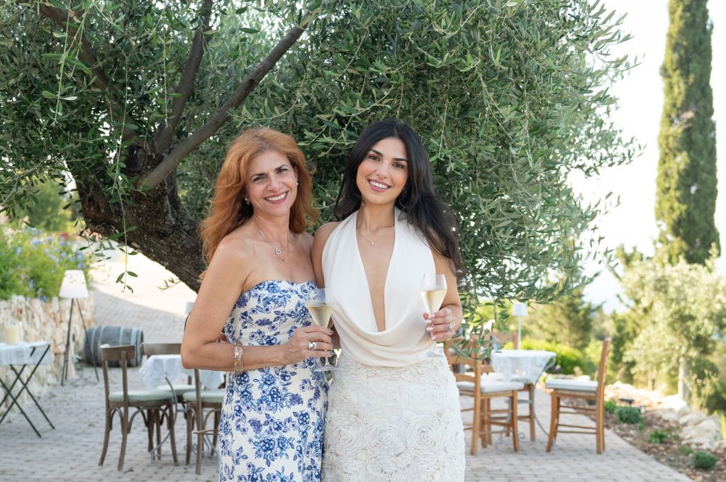 Bride and her mother at pre-wedding dinner party in Ithaca Greece, Stavros