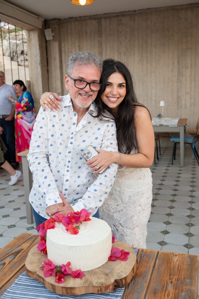 Bride and her father at pre-wedding dinner party in Ithaca Greece, Stavros
