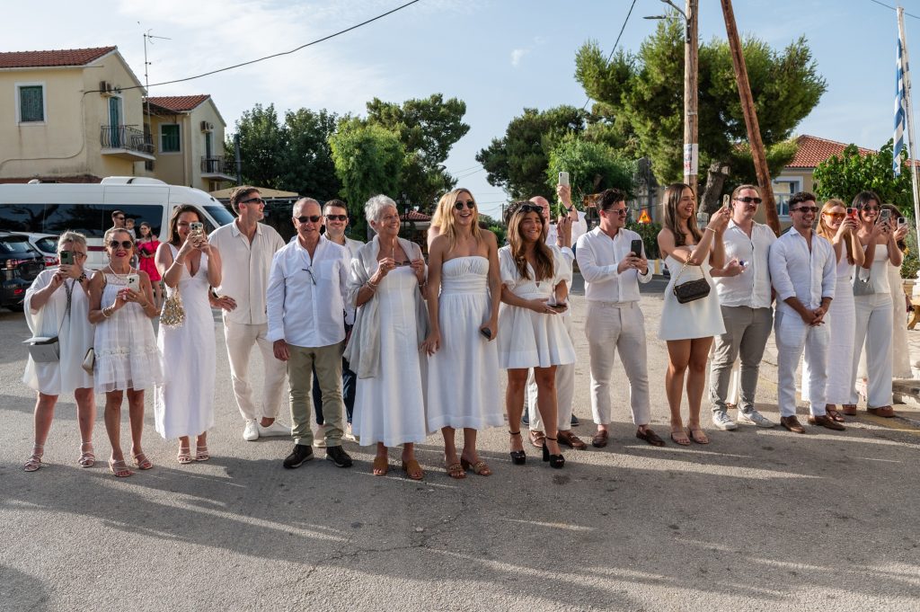 Guests in front of the church at wedding in Ithaca Greece, Stavros