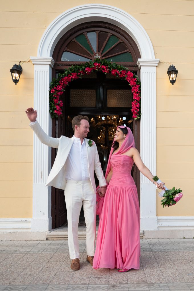 Couple in front of the church at wedding in Ithaca Greece, Stavros