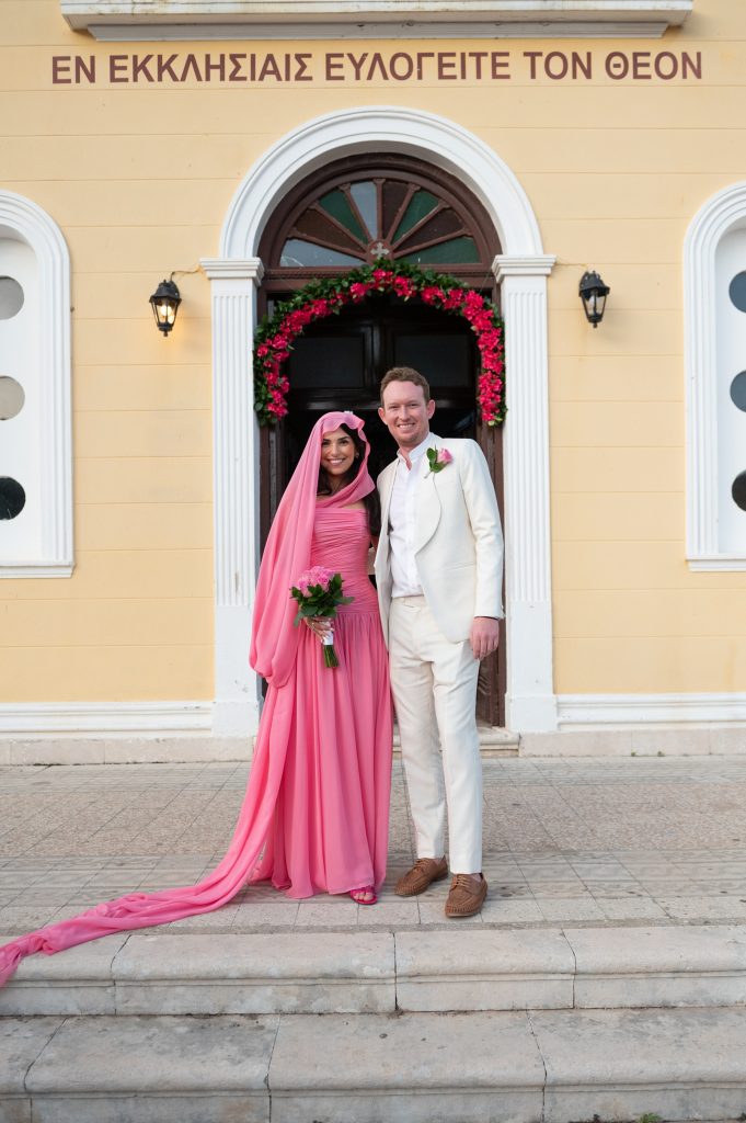 Couple in front of the church at wedding in Ithaca Greece, Stavros