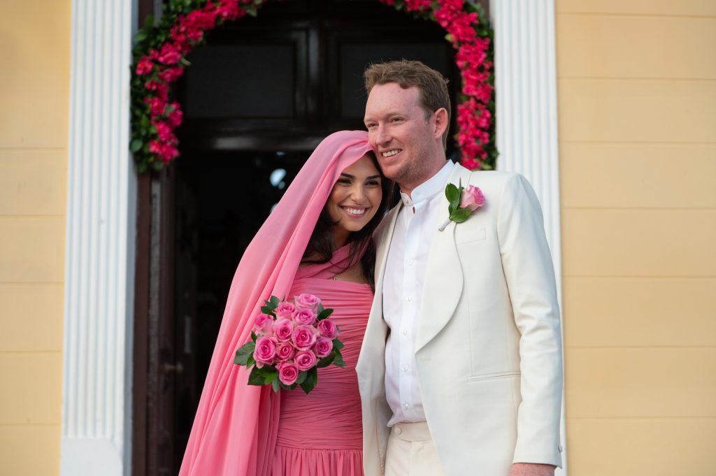 Couple in front of the church at wedding in Ithaca Greece, Stavros