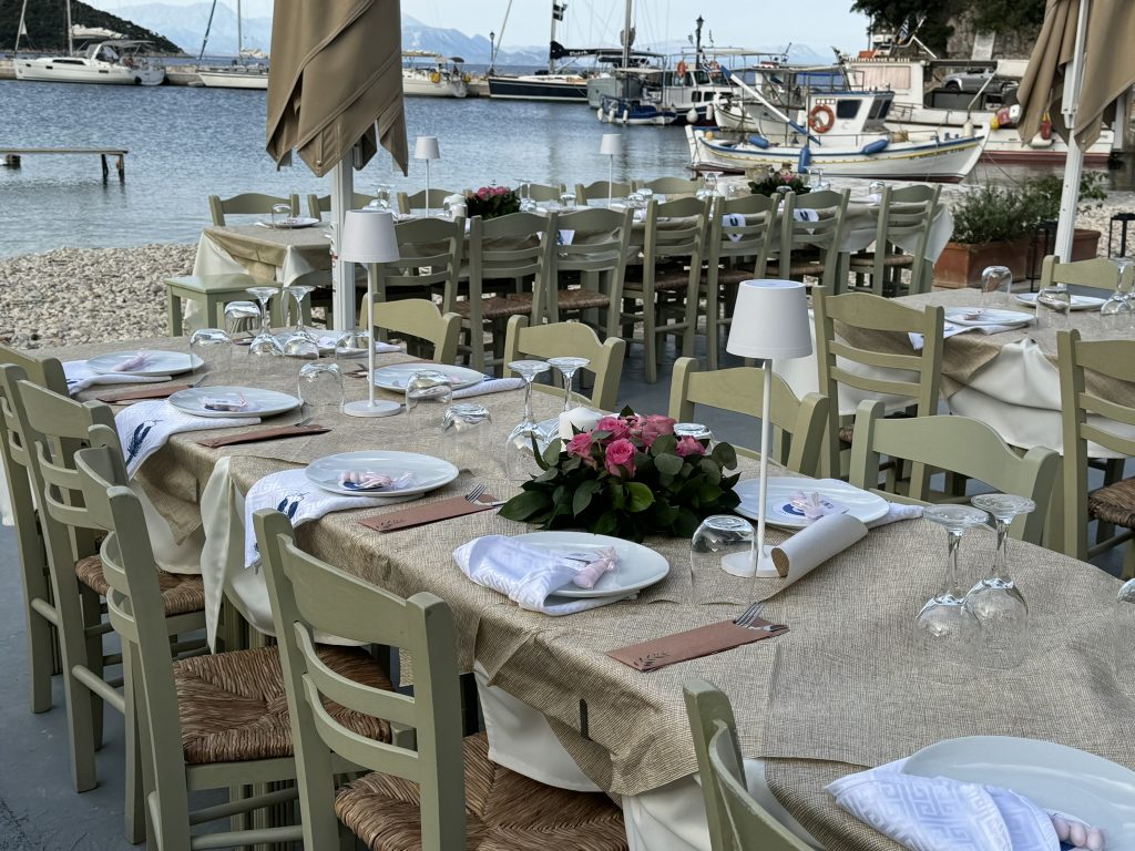 Wedding reception tables at beach restaurant in Ithaca Greece, Frikes